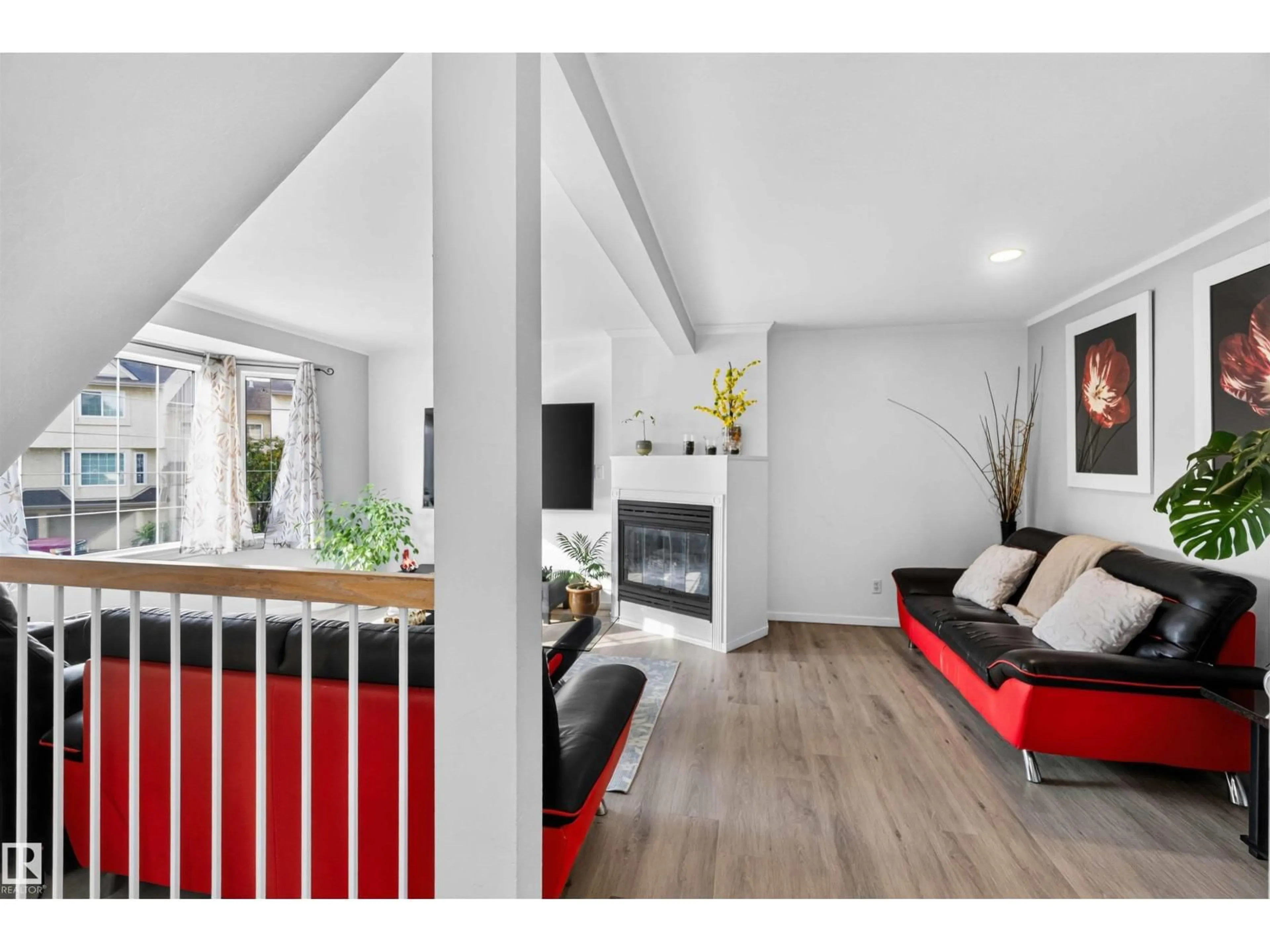 Living room with furniture, wood/laminate floor for #28 - 3645 145 AV, Edmonton Alberta T5Y2S3