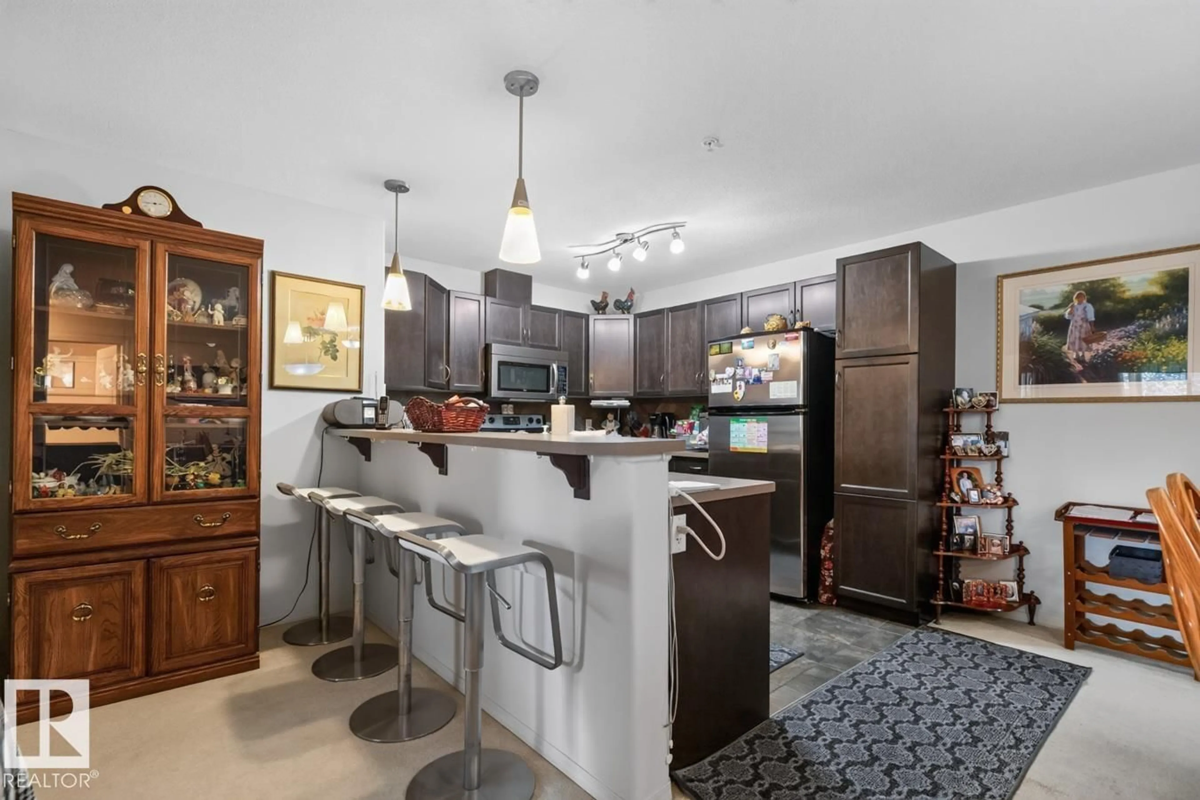 Open concept kitchen, ceramic/tile floor for 210 - 7909 71 ST, Edmonton Alberta T6B3P5