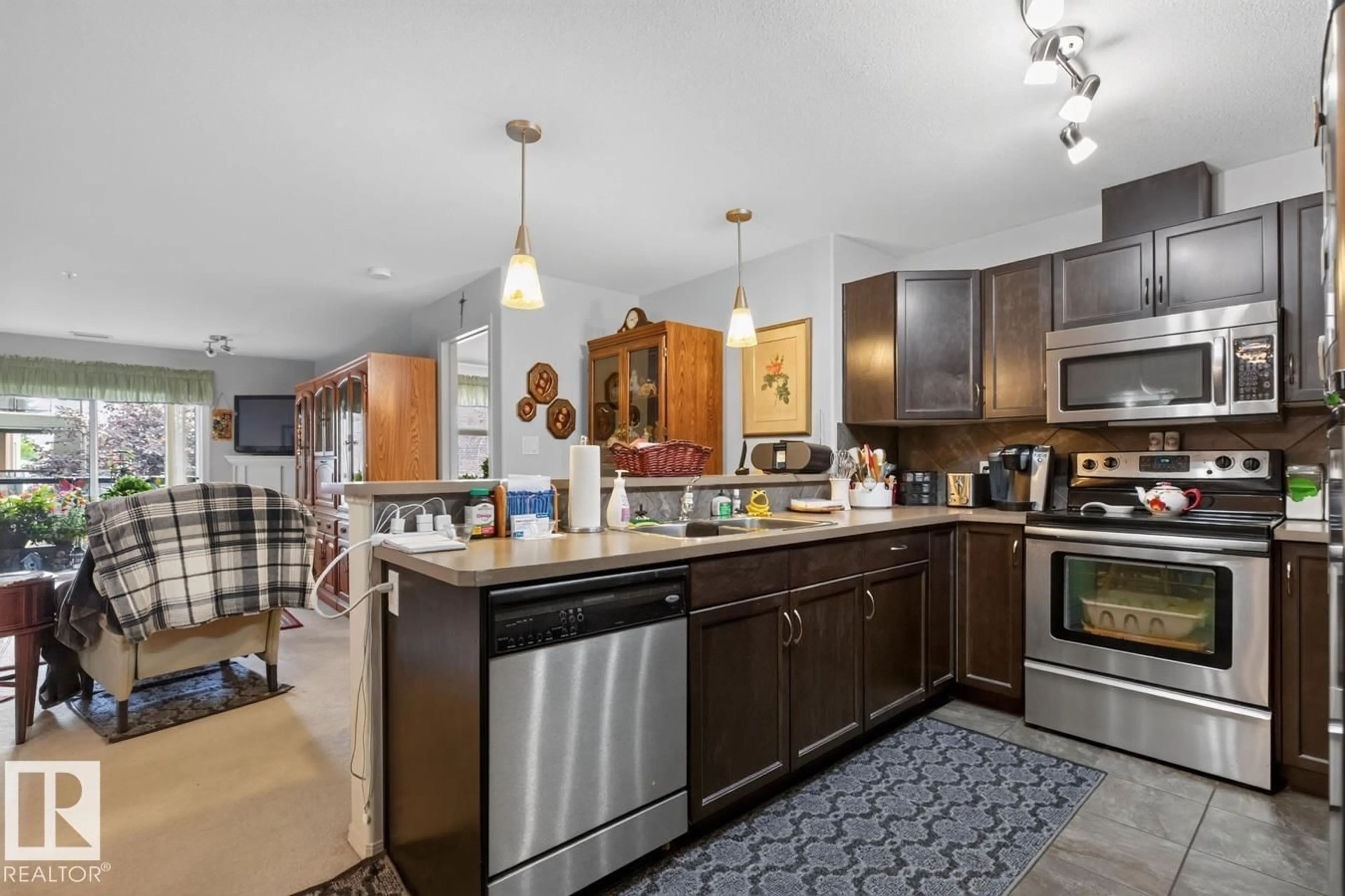 Open concept kitchen, ceramic/tile floor for 210 - 7909 71 ST, Edmonton Alberta T6B3P5
