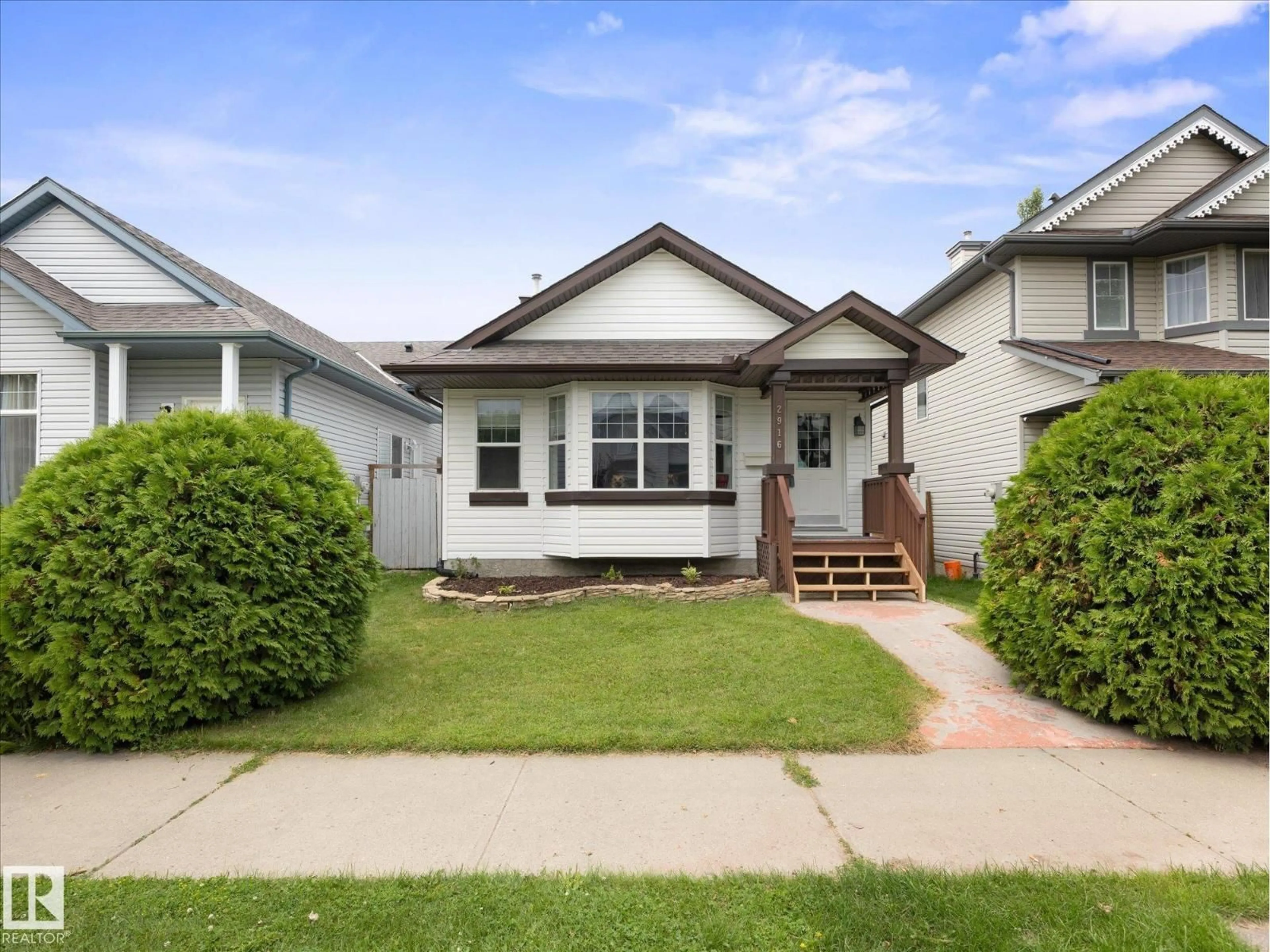 Home with vinyl exterior material, street for 2916 31 ST, Edmonton Alberta T6T1T9