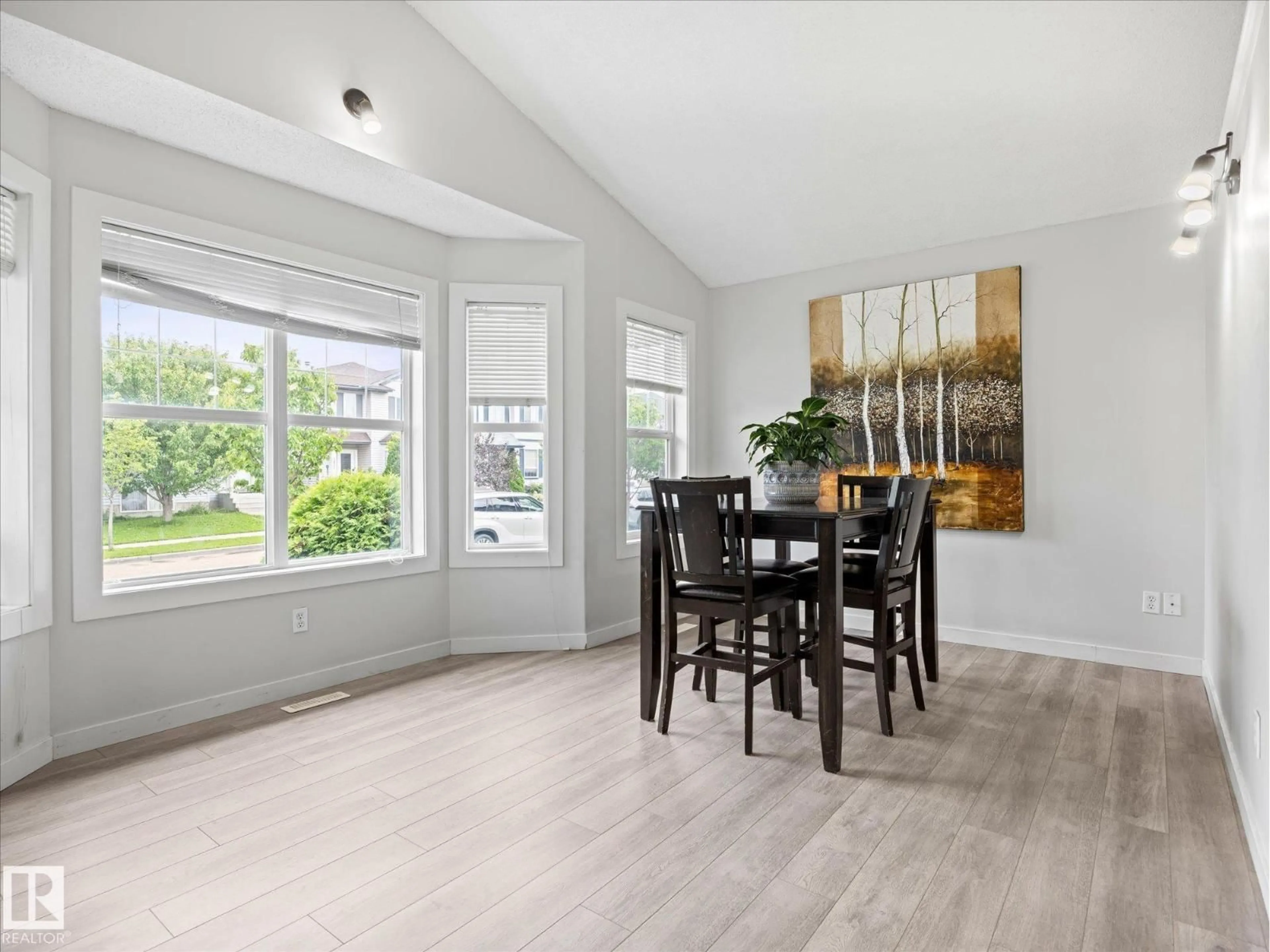 Dining room, wood/laminate floor for 2916 31 ST, Edmonton Alberta T6T1T9