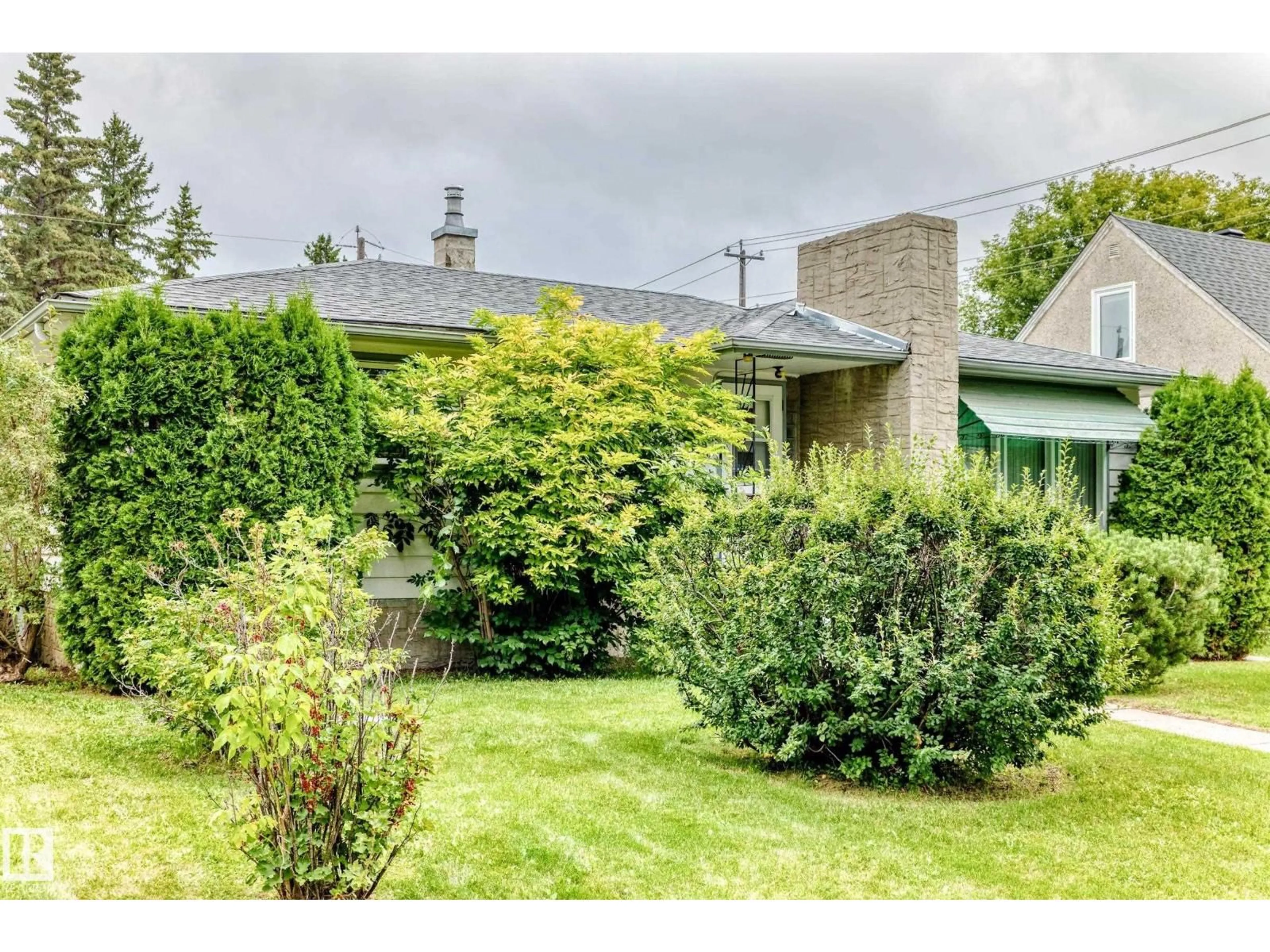A pic from outside/outdoor area/front of a property/back of a property/a pic from drone, street for 12720 120 AV, Edmonton Alberta T5L2R1