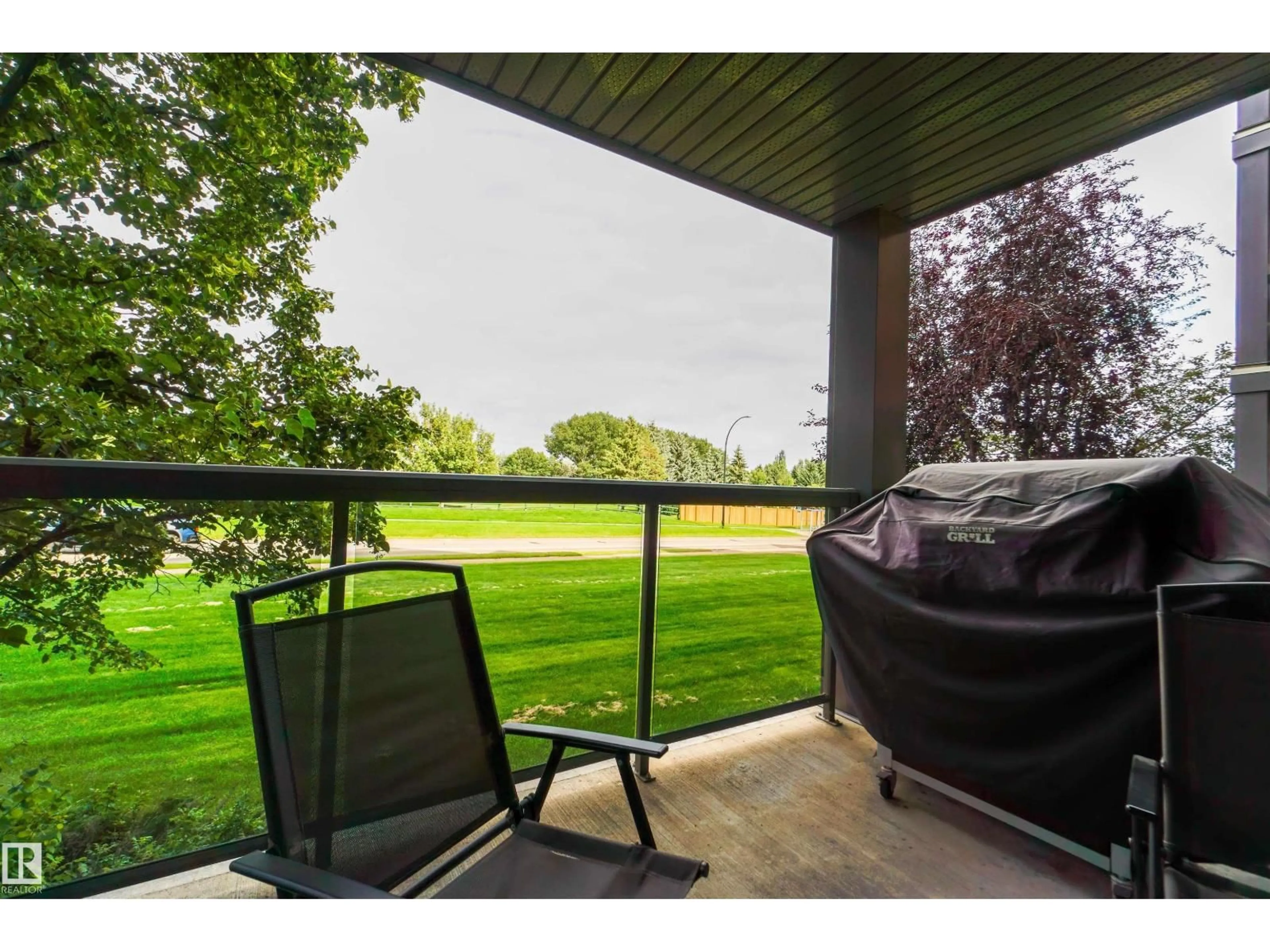 Patio, water/lake/river/ocean view for 128 SUDER GREENS DR, Edmonton Alberta T5T6X6