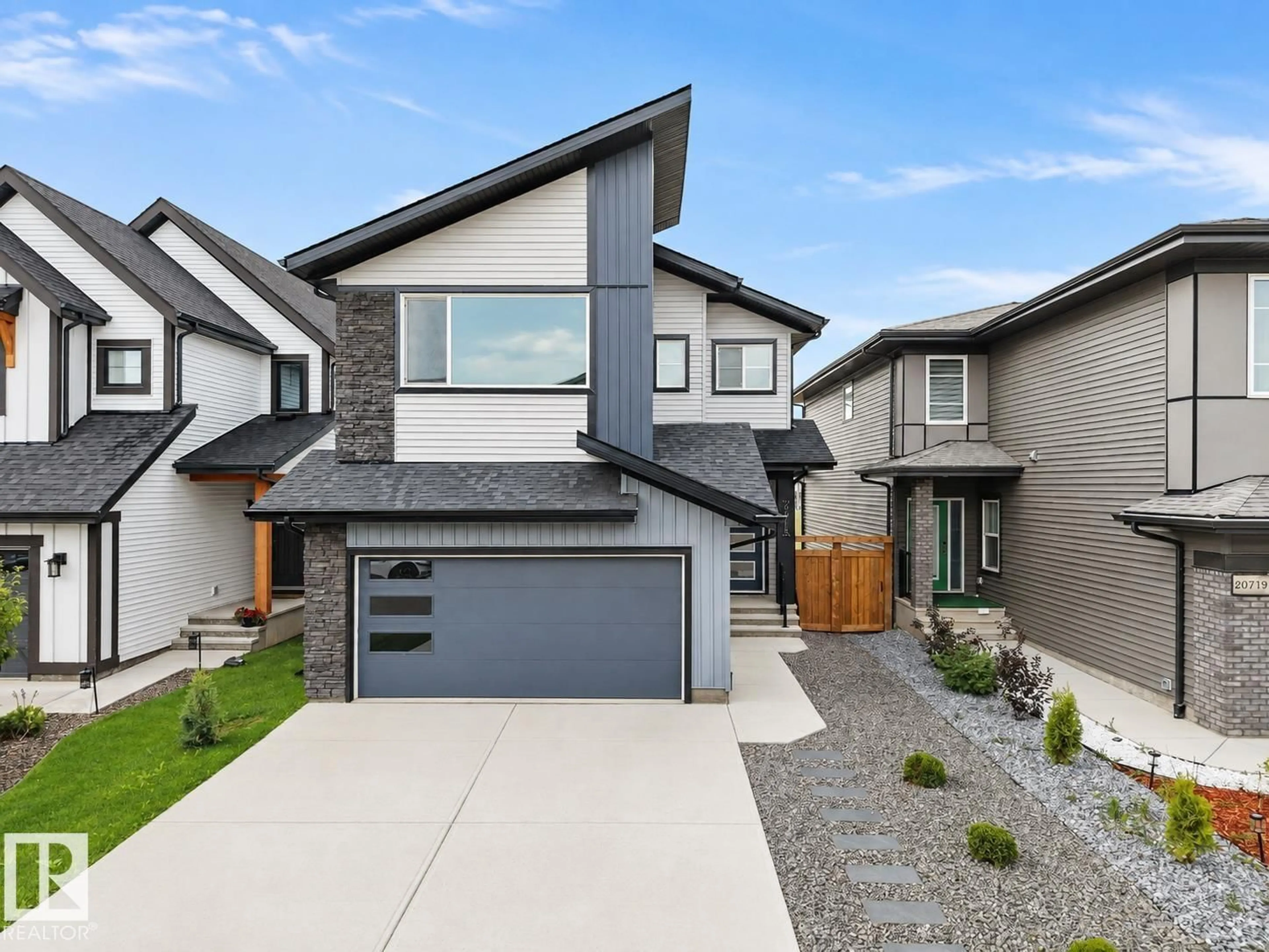 Home with brick exterior material, street for 20715 27 AV, Edmonton Alberta T6M1P3