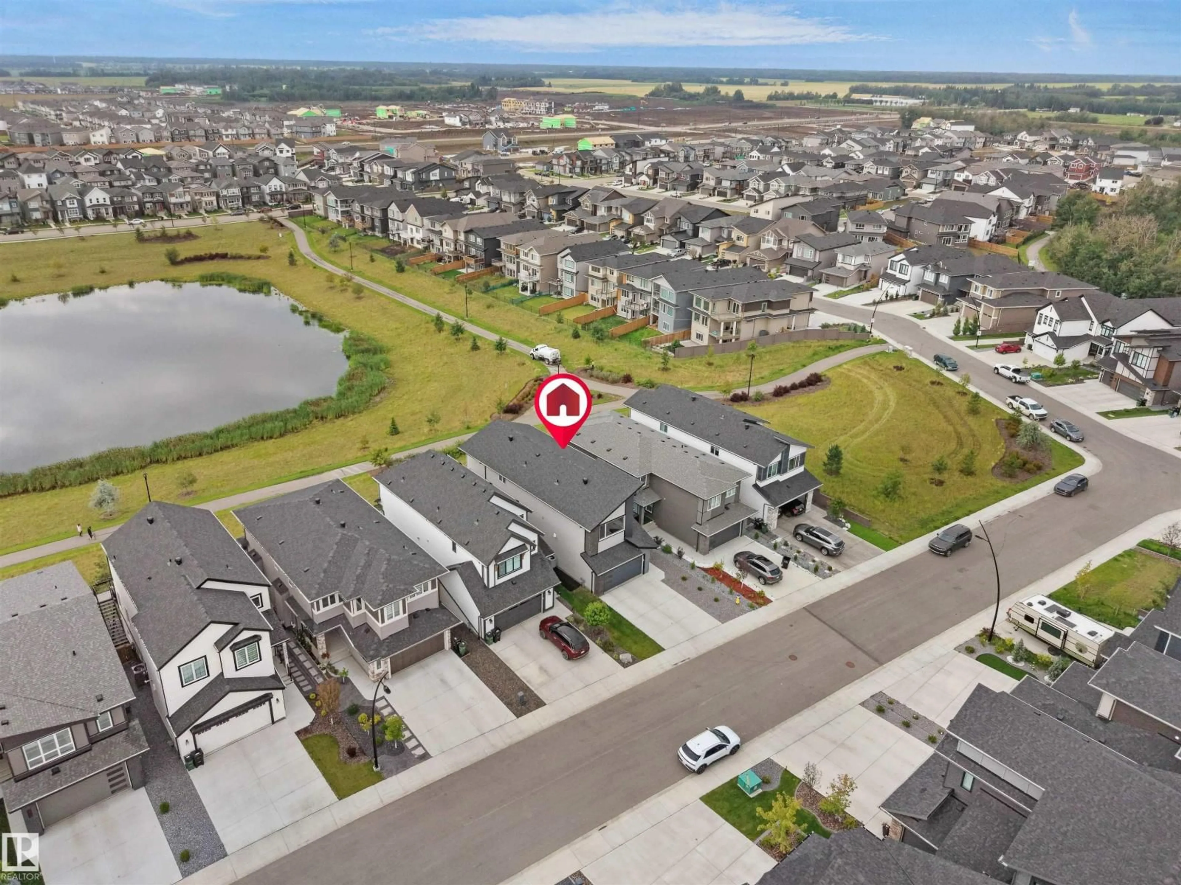 A pic from outside/outdoor area/front of a property/back of a property/a pic from drone, water/lake/river/ocean view for 20715 27 AV, Edmonton Alberta T6M1P3