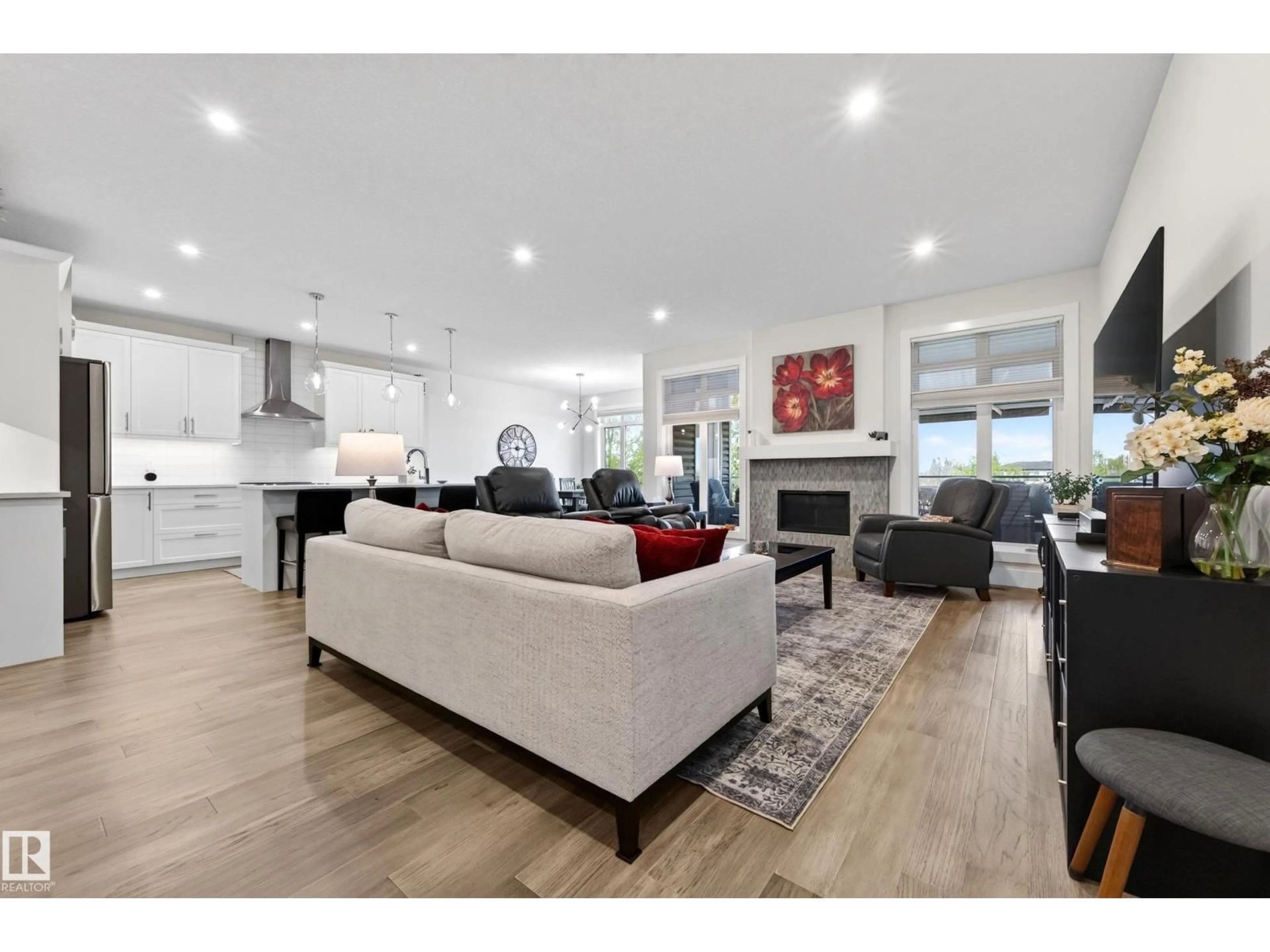 Living room with furniture, wood/laminate floor for 91 HARVEST CR, Ardrossan Alberta T8E0A8