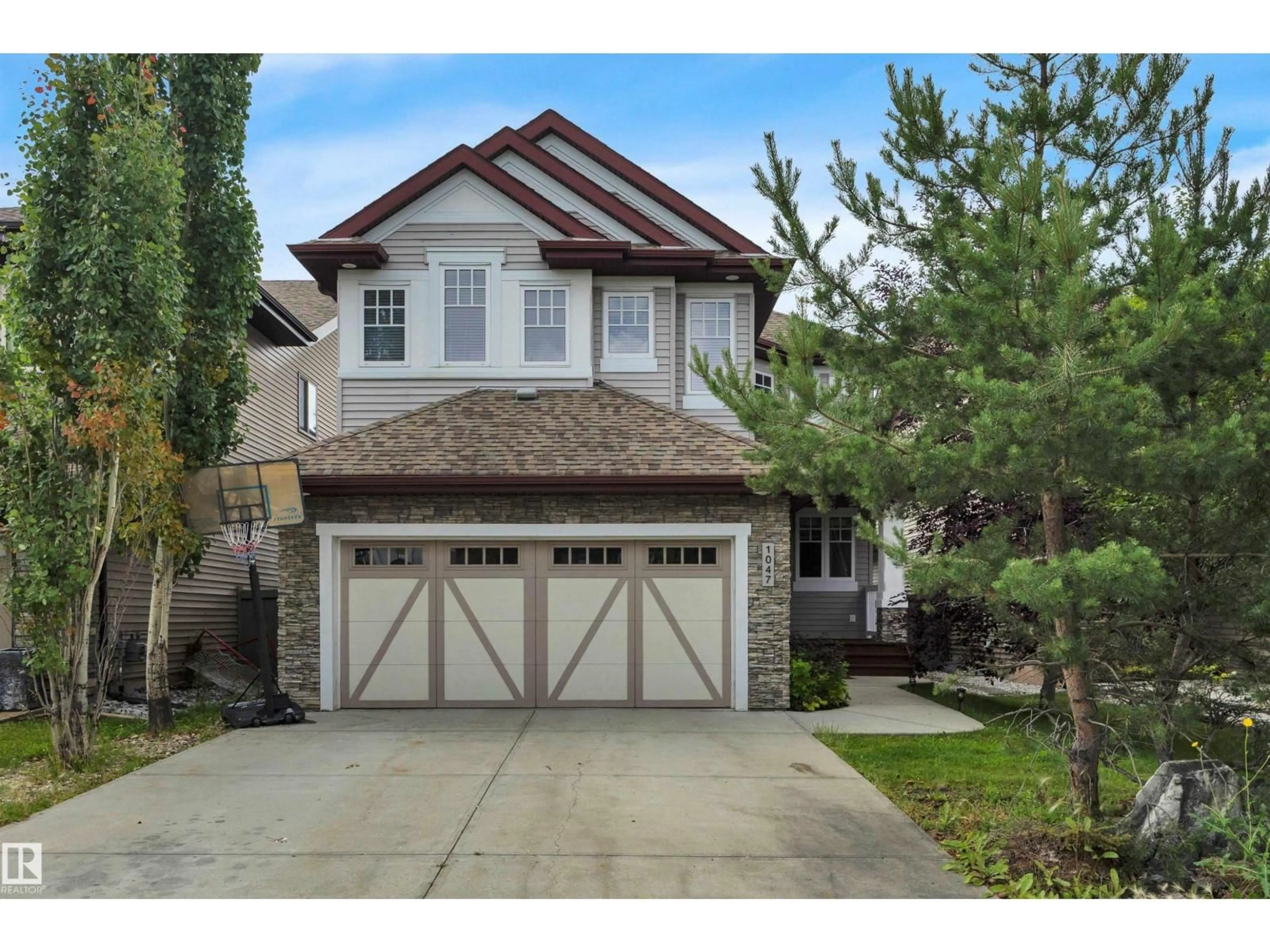 Home with vinyl exterior material, street for 1047 ARMITAGE CR, Edmonton Alberta T6W0K3