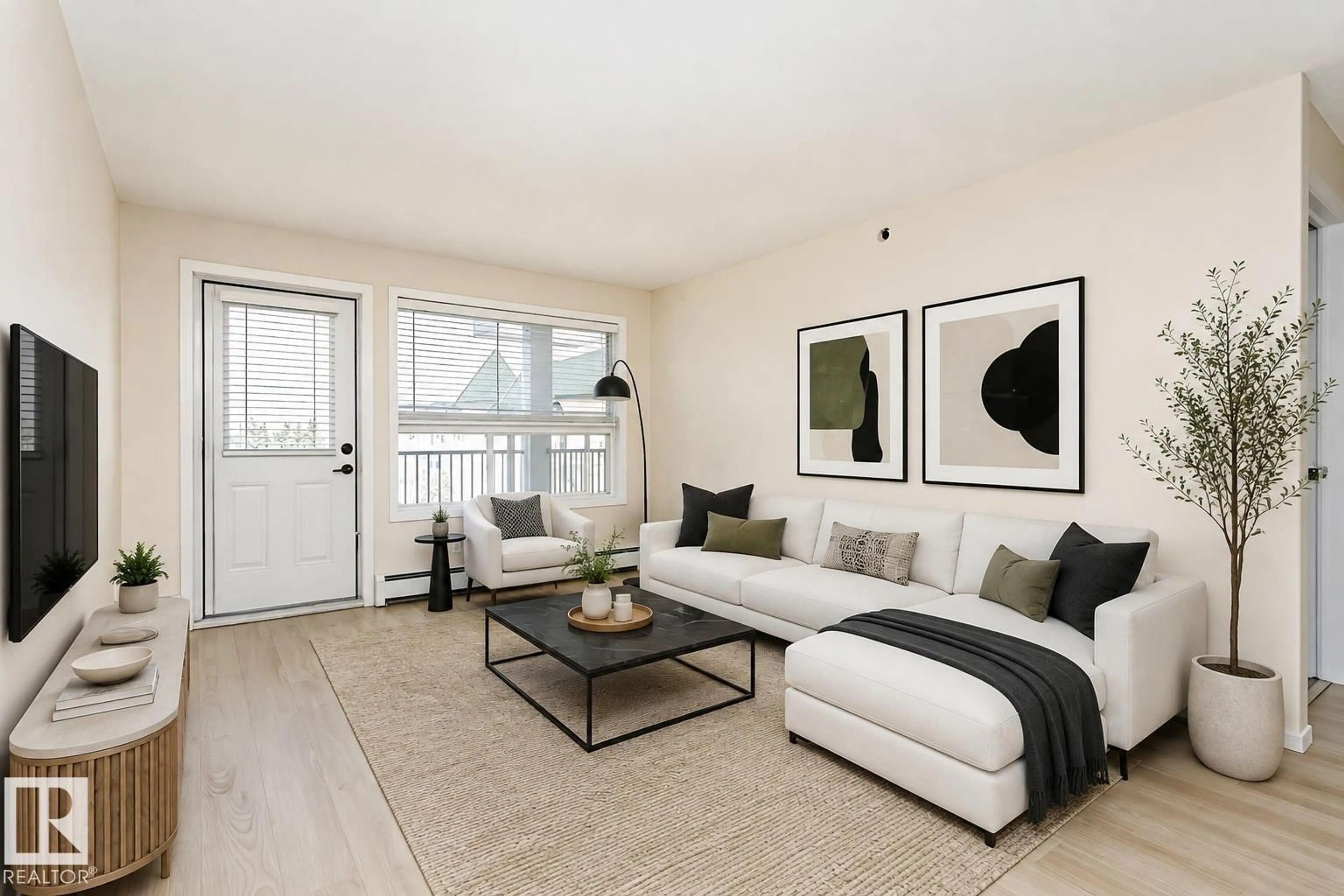 Living room with furniture, wood/laminate floor for 423 13625 34 ST NW, Edmonton Alberta T5A0E3
