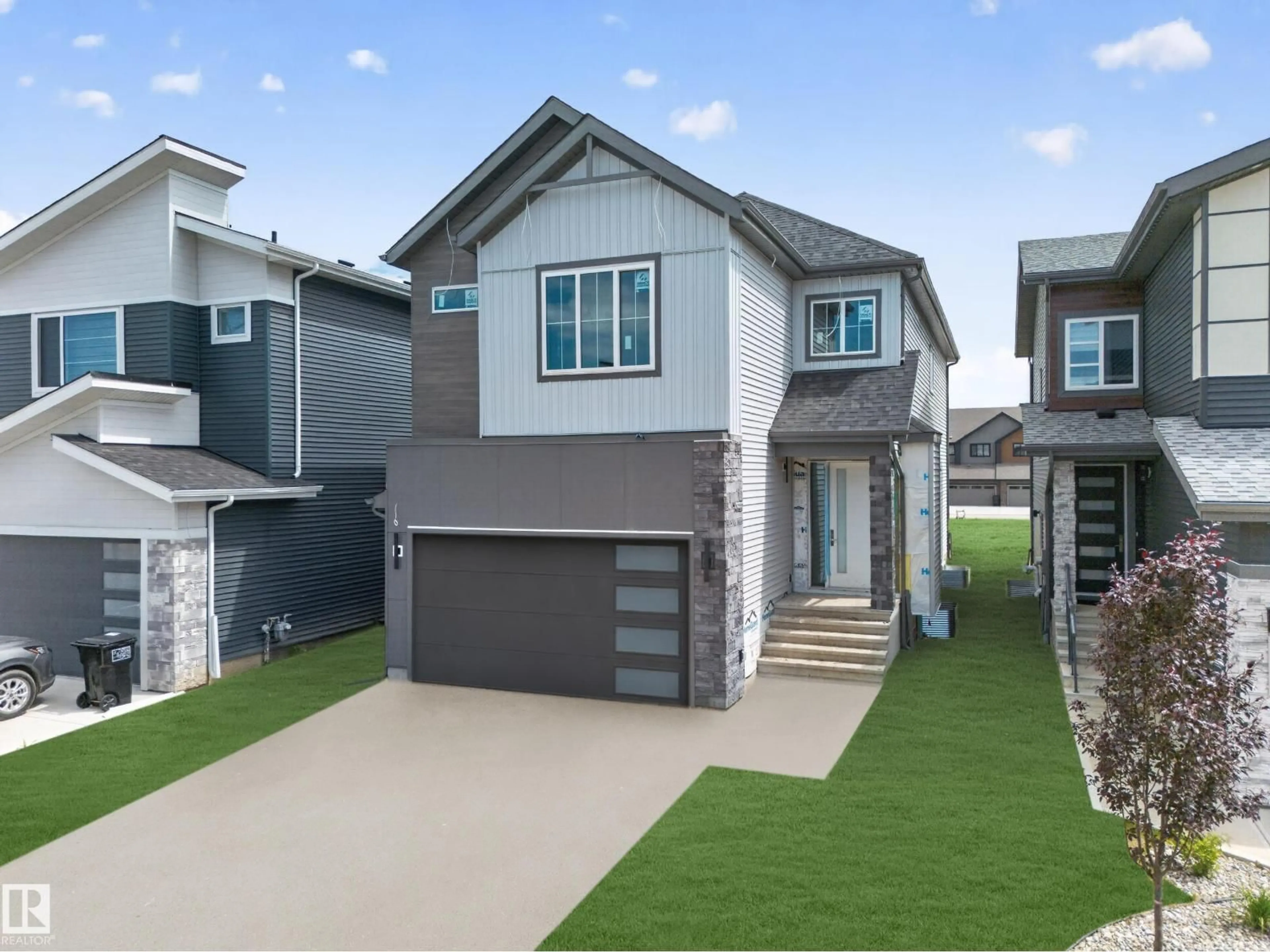 Home with vinyl exterior material, street for 8915 MAYDAY WY, Edmonton Alberta T6X3E9