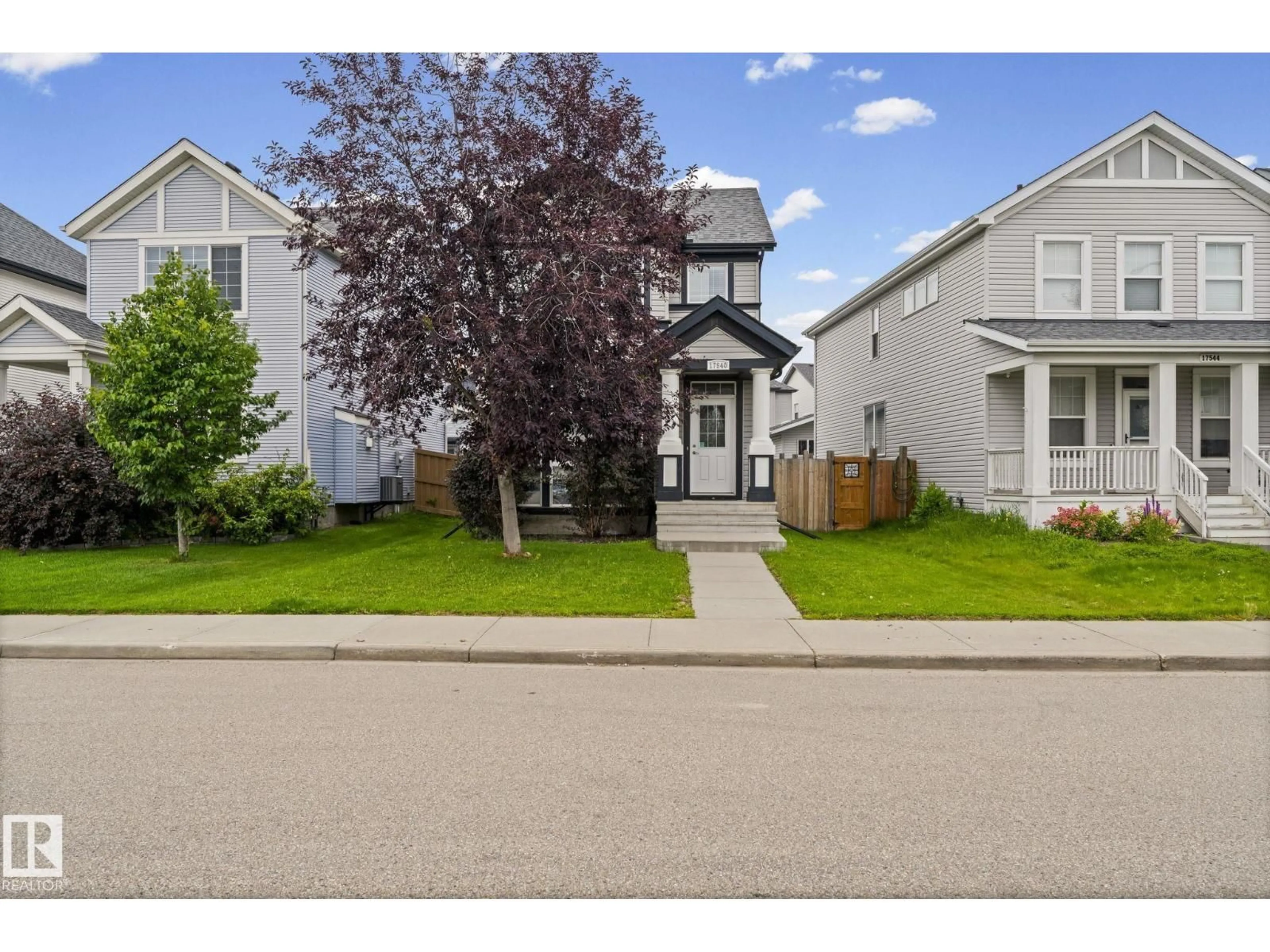 Home with vinyl exterior material, street for 17540 58 ST, Edmonton Alberta T5Y0T7