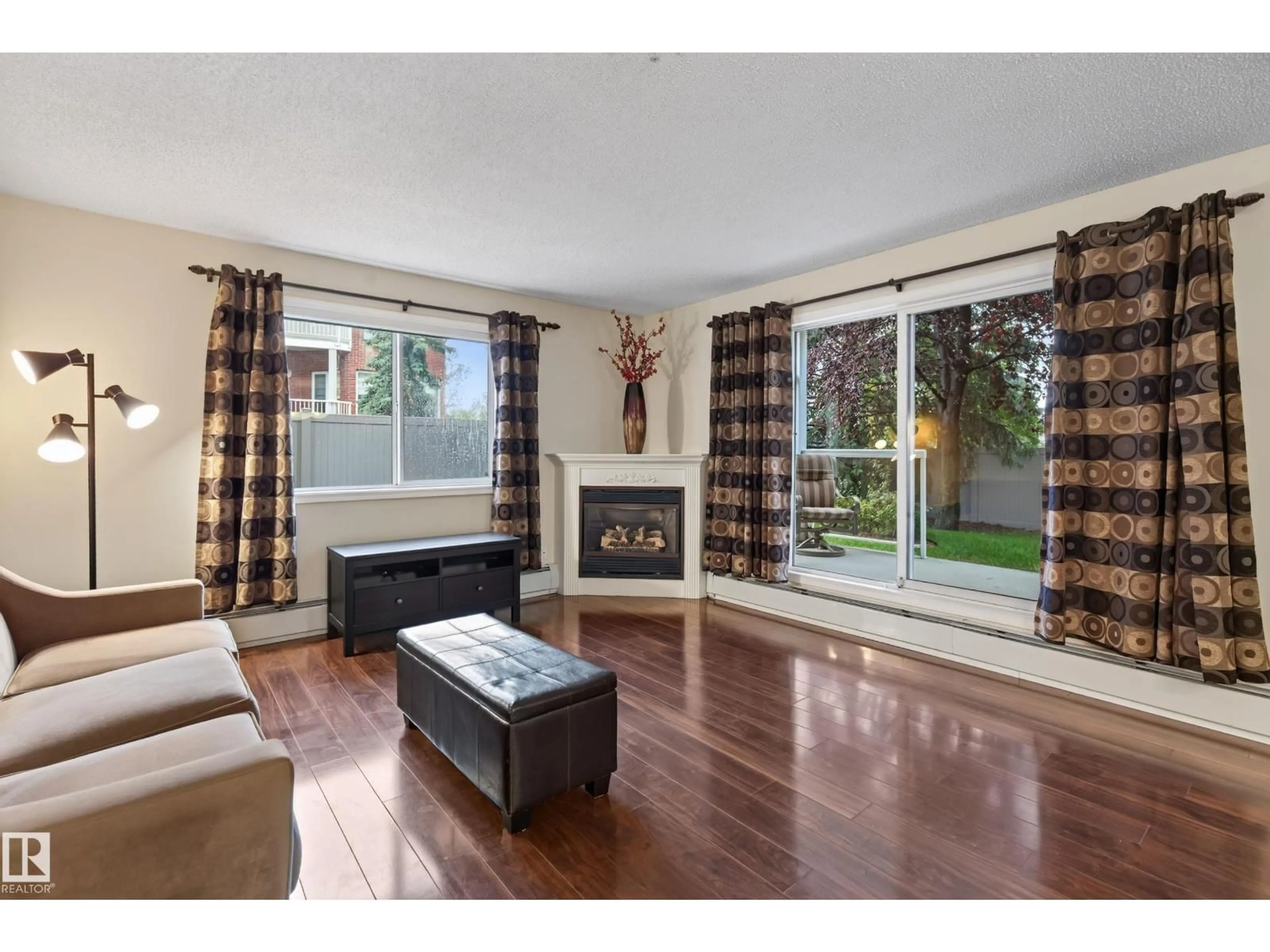 Living room with furniture, wood/laminate floor for 101 - 101 RABBIT HILL RD, Edmonton Alberta T6R2S7
