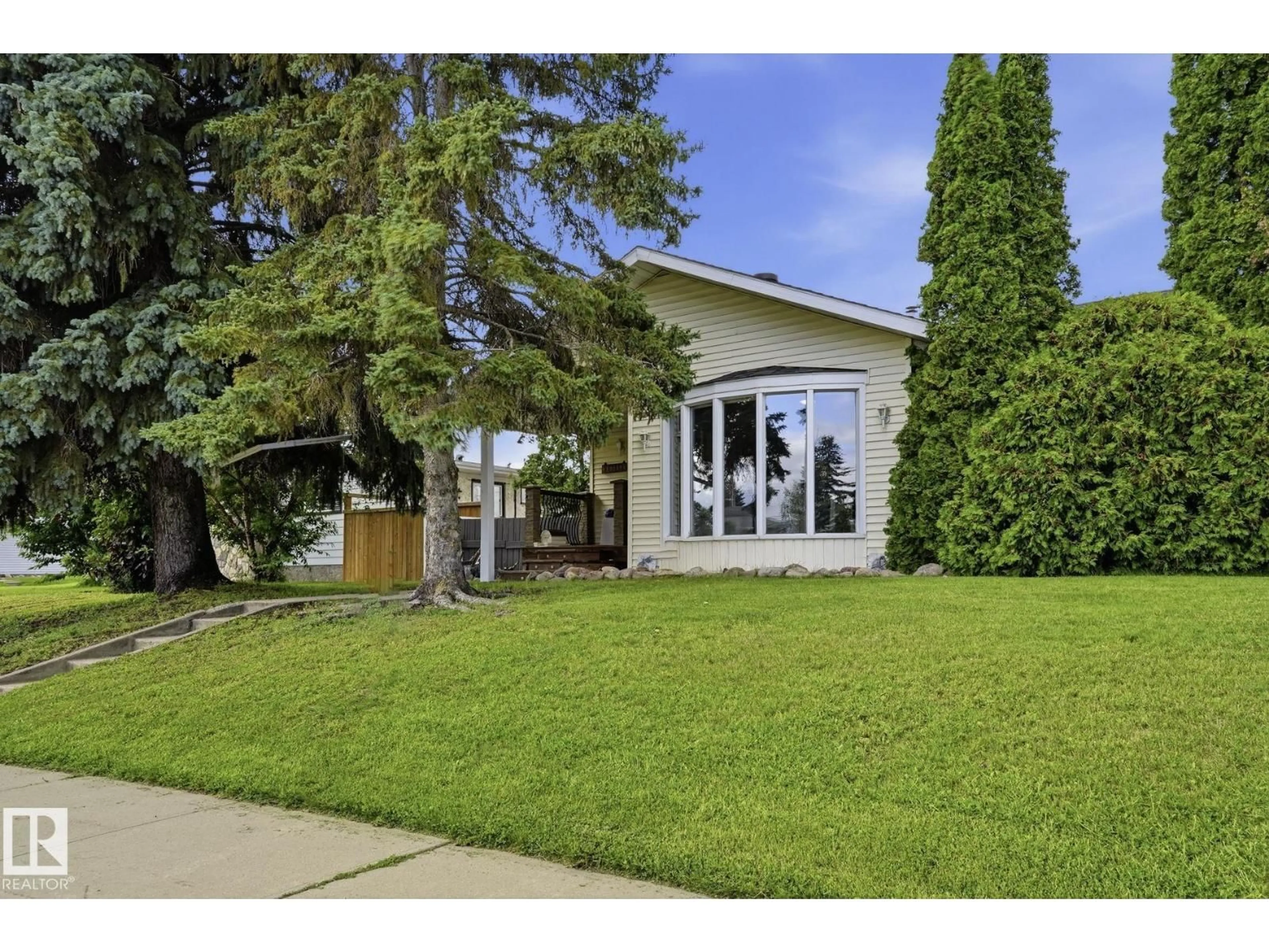 Home with vinyl exterior material, street for 10528 45 ST, Edmonton Alberta T6A1X5