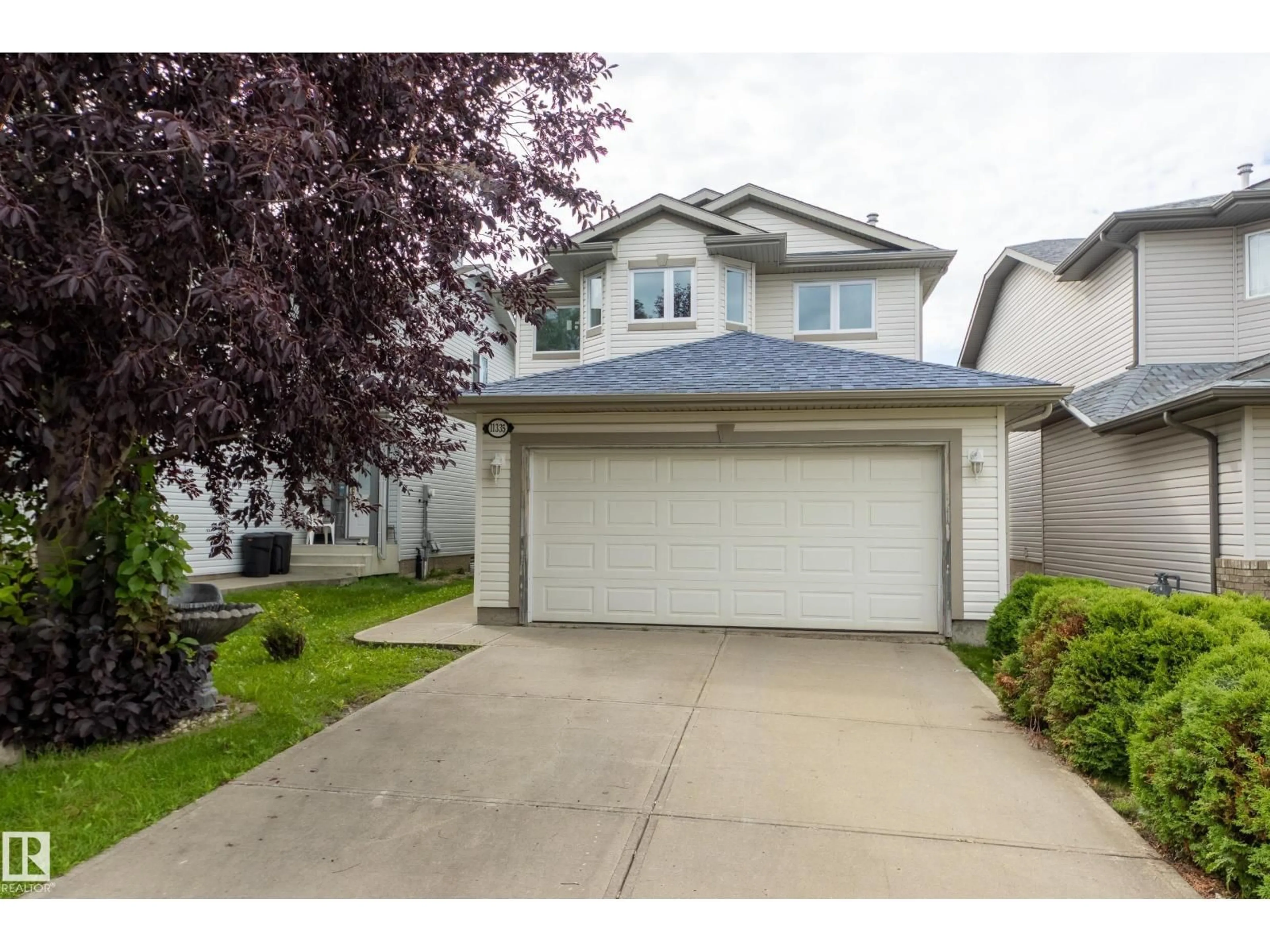 Home with vinyl exterior material, street for NW - 11335 167B AVE, Edmonton Alberta T5X6G8