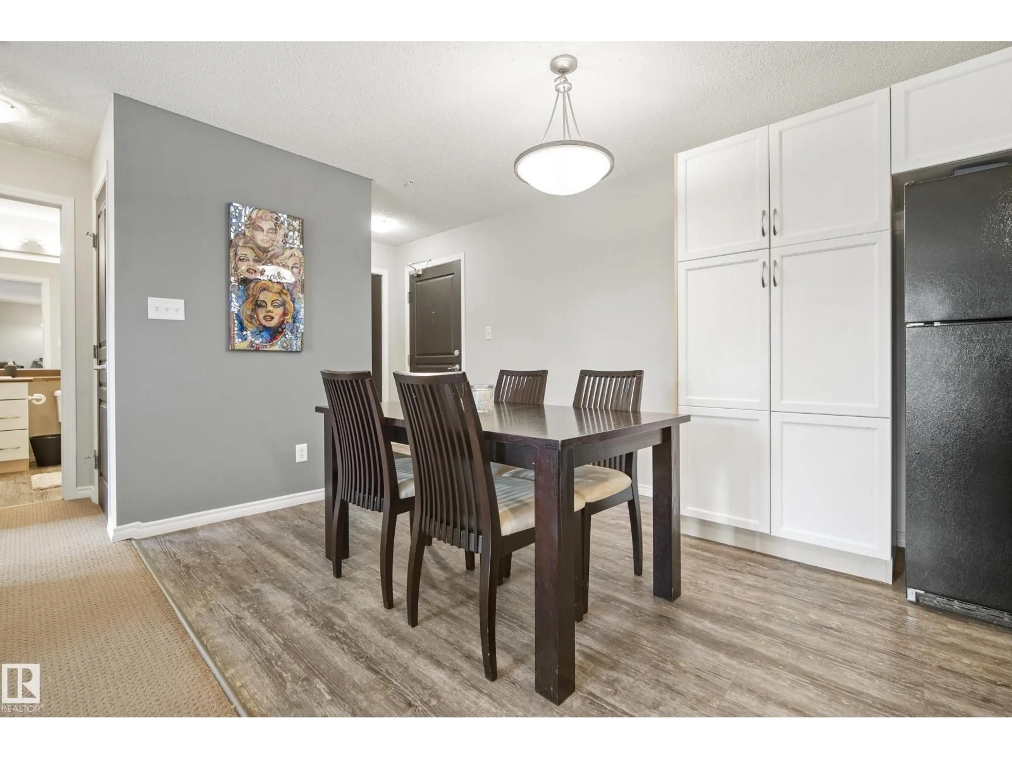 Dining room, wood/laminate floor for 340 2436 GUARDIAN RD, Edmonton Alberta T5T2P5