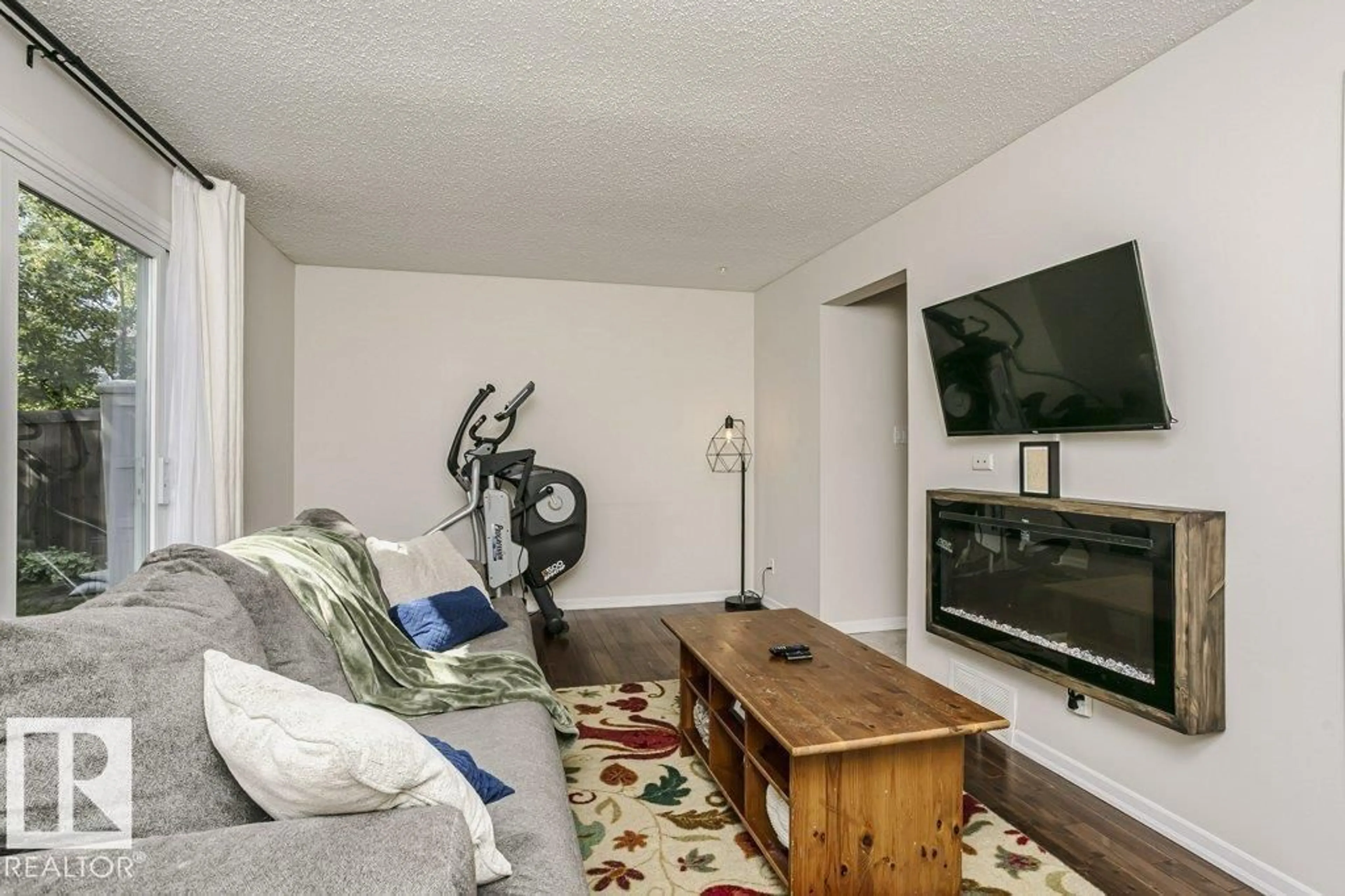 Living room with furniture, wood/laminate floor for 117 WOODSTOCK NW, Edmonton Alberta T5T0H6