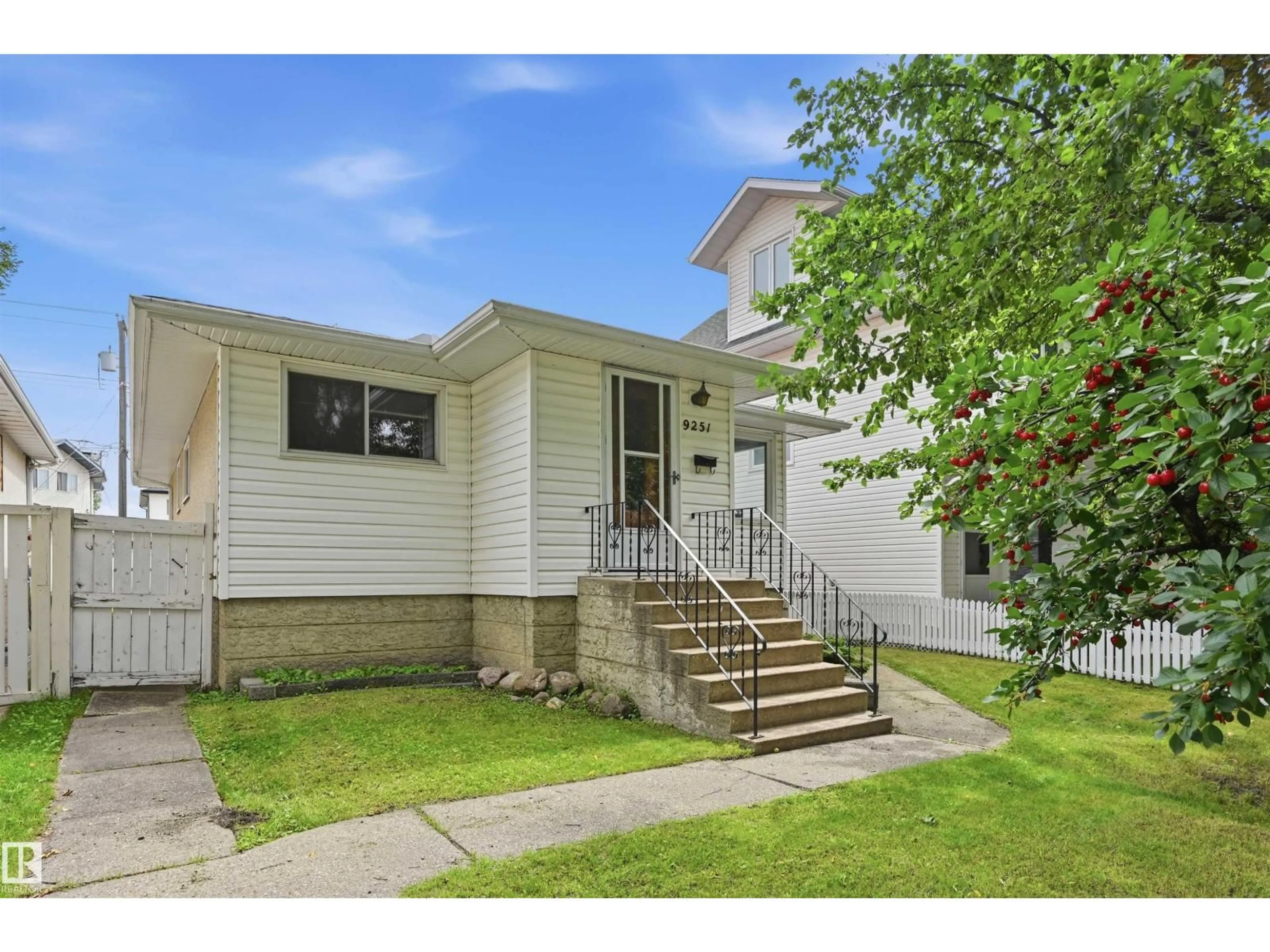 Home with vinyl exterior material, street for NW - 9251 91 ST, Edmonton Alberta T6C3N7
