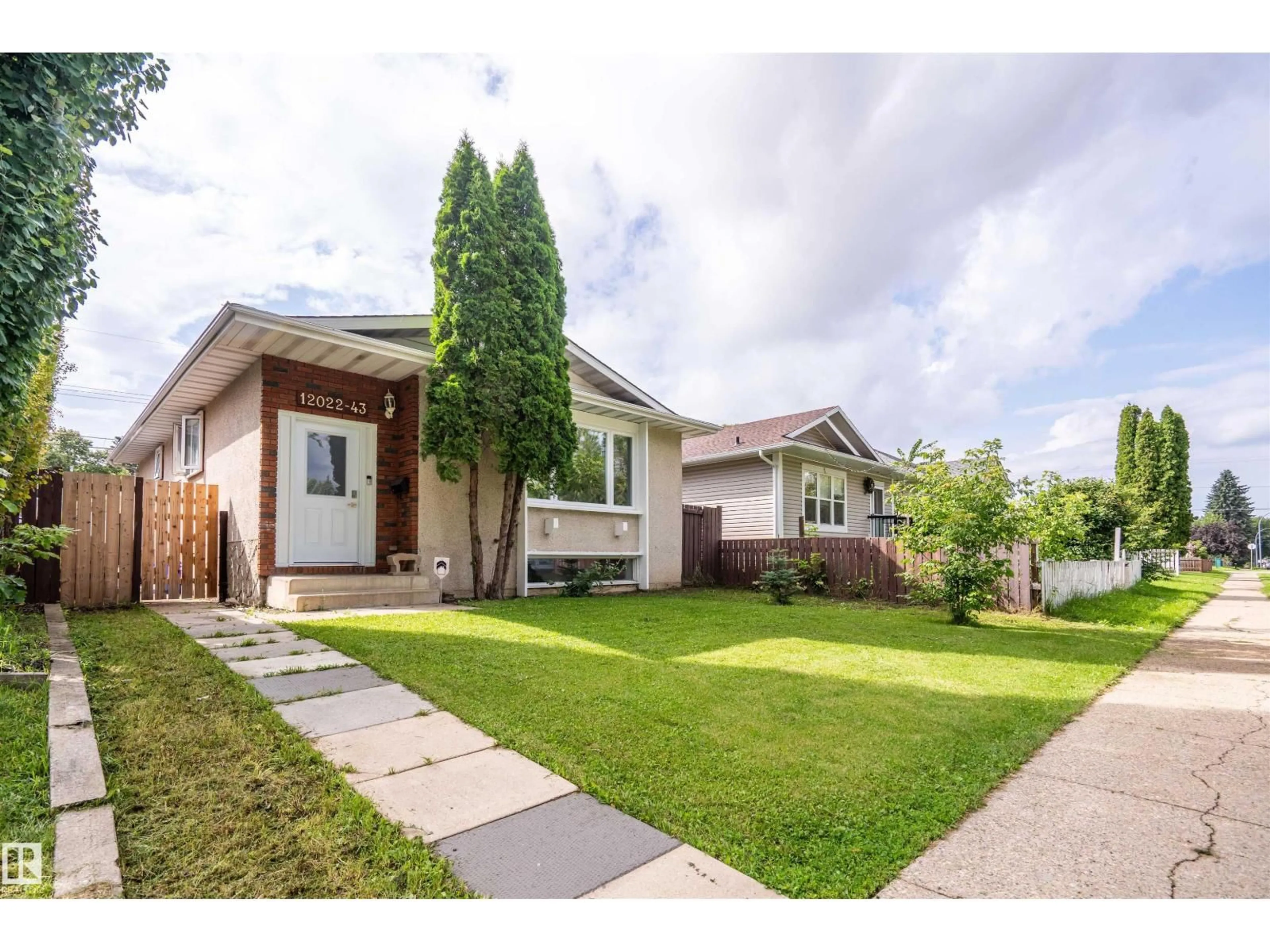 Home with vinyl exterior material, street for 12022 43 ST, Edmonton Alberta T5W2P8
