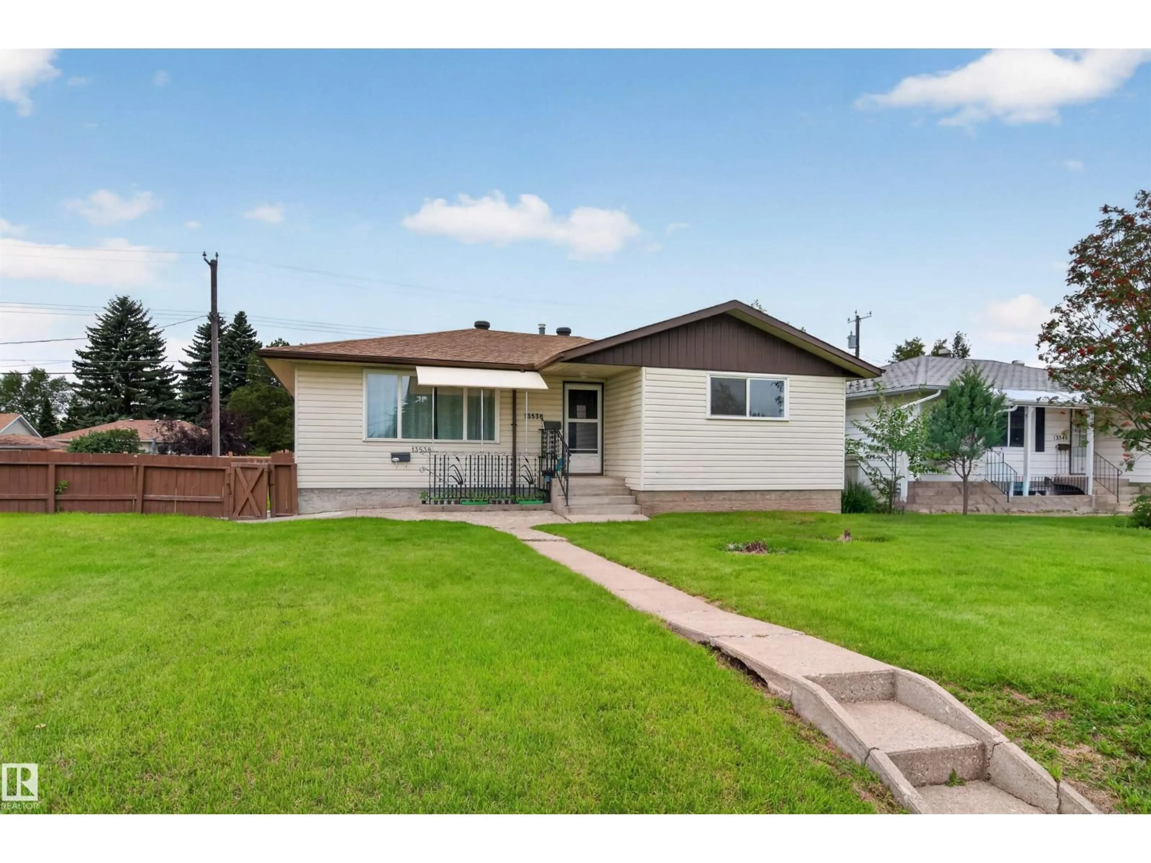 Home with vinyl exterior material, street for 13536 119 ST, Edmonton Alberta T5E5N2