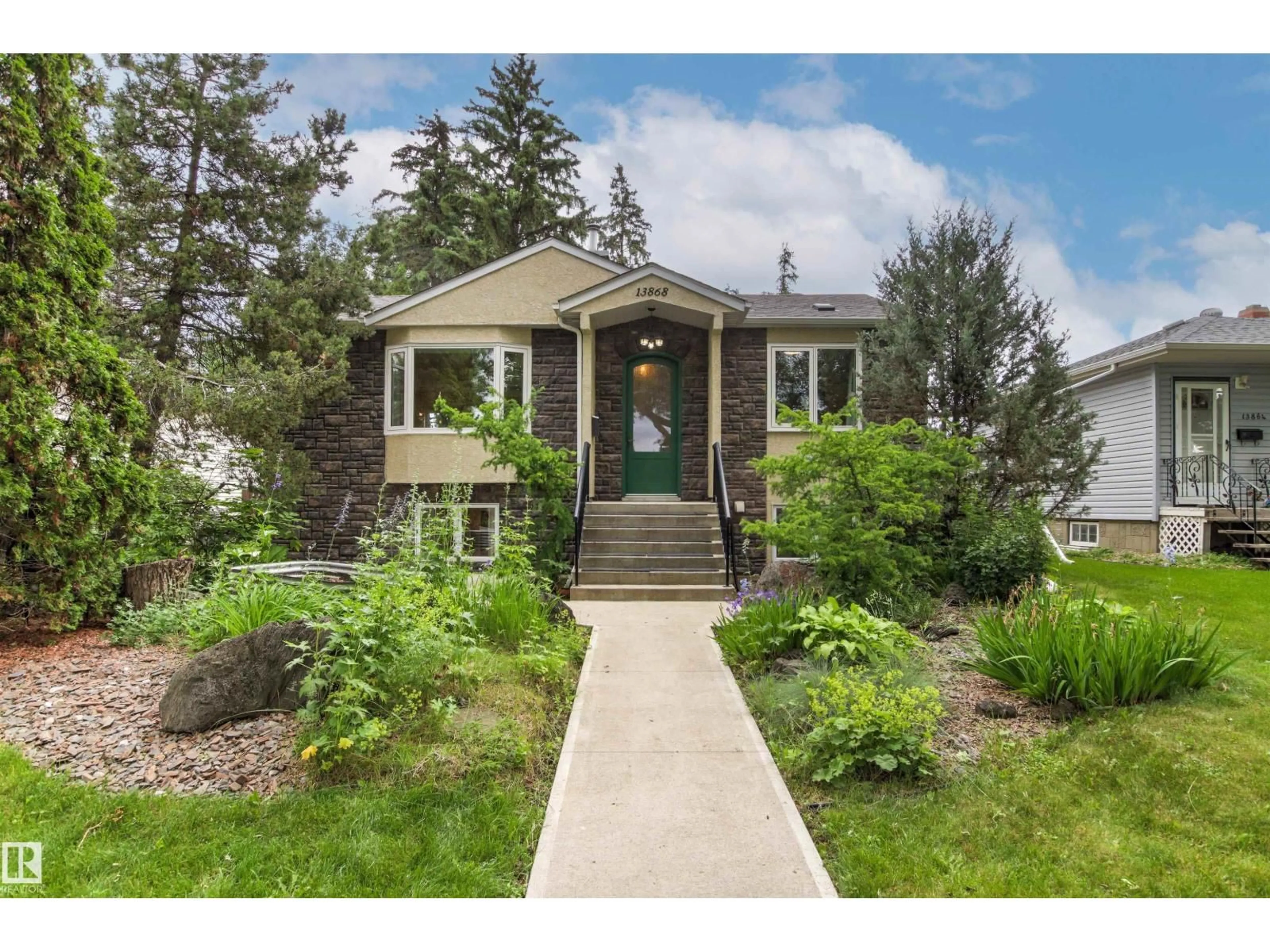 Home with vinyl exterior material, street for 13868 110A AV, Edmonton Alberta T5M2M9