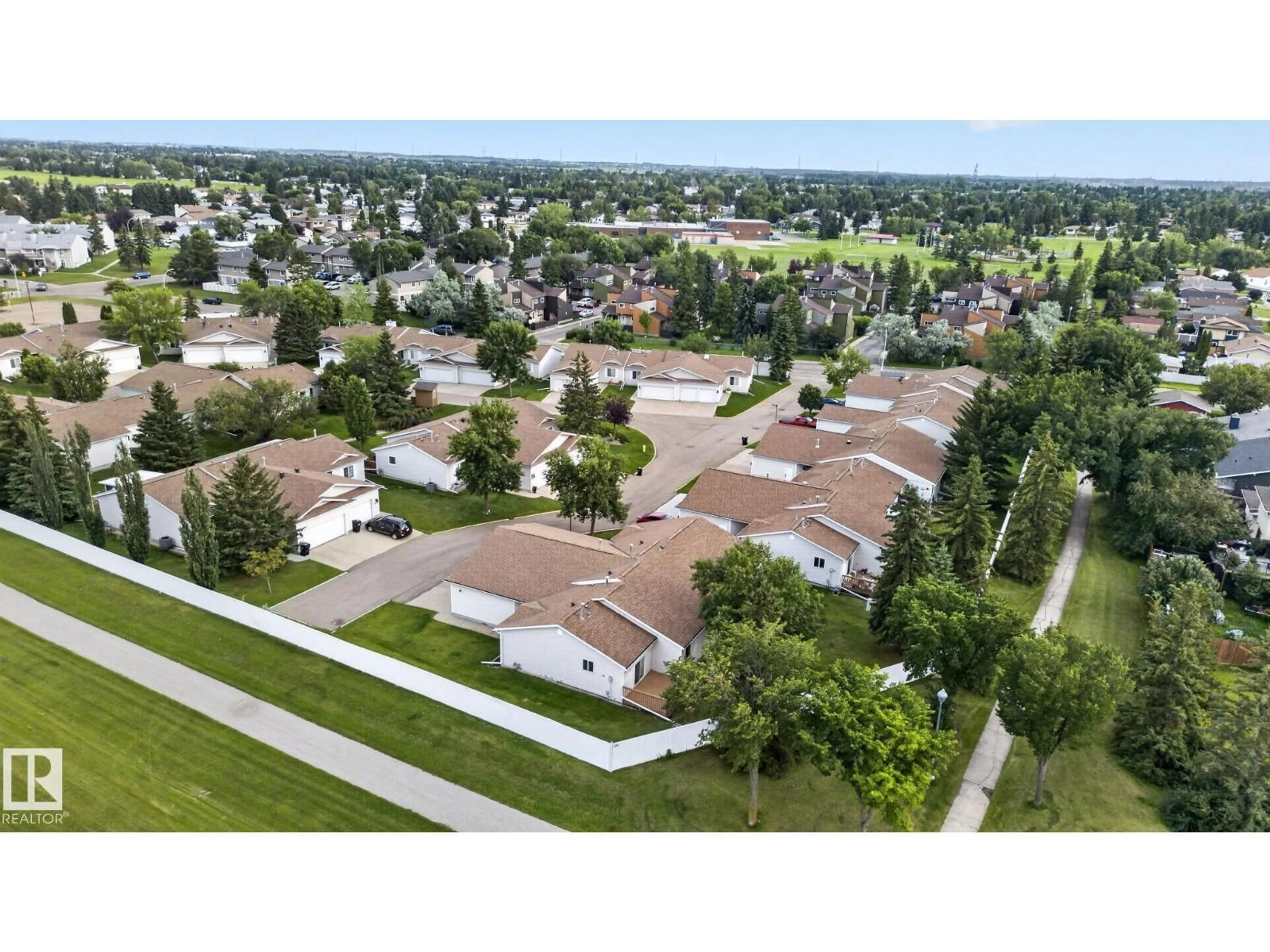 A pic from outside/outdoor area/front of a property/back of a property/a pic from drone, street for 8146 27 AV, Edmonton Alberta T6K4C9