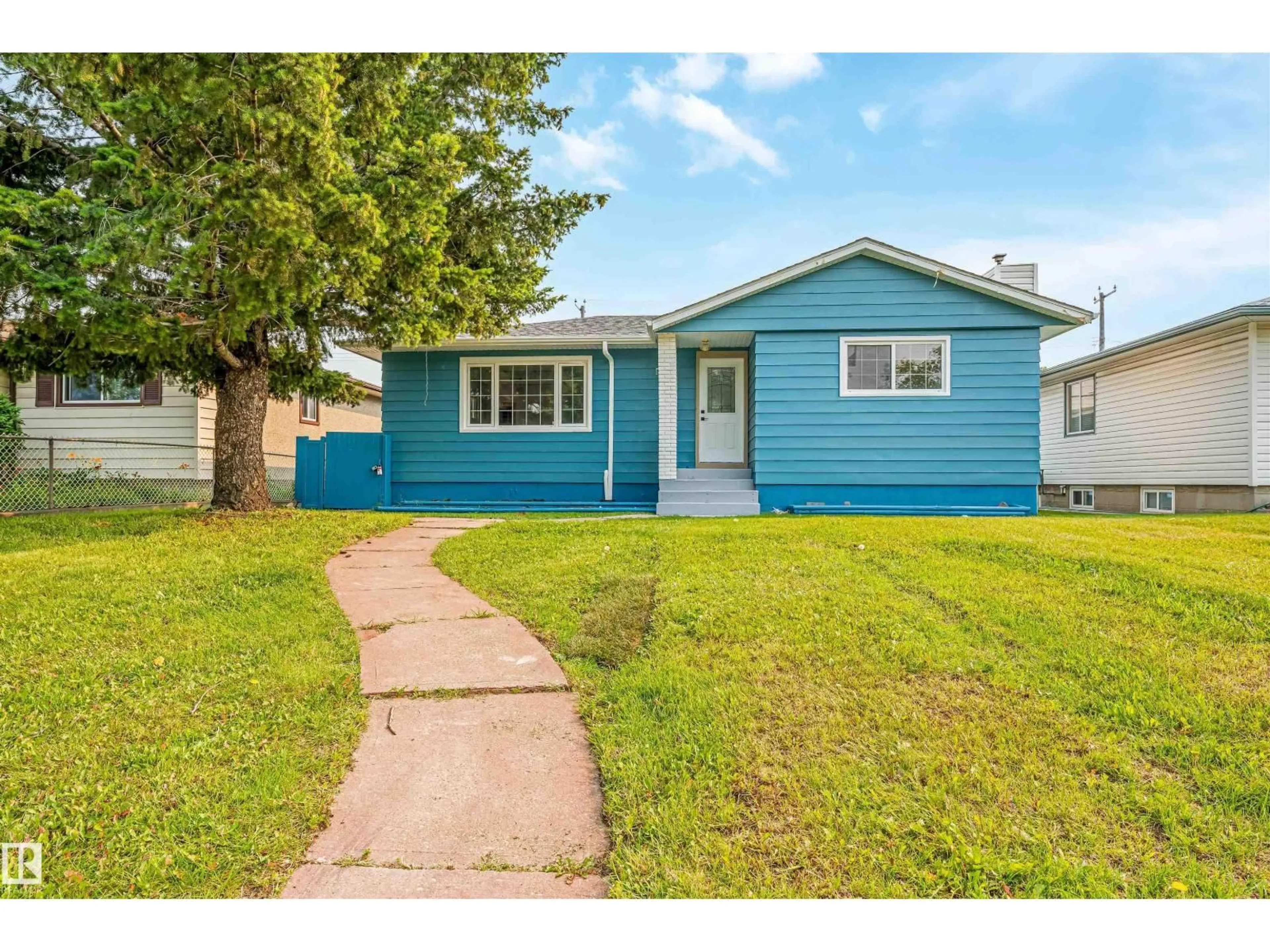 Home with vinyl exterior material, street for 12023 137 AV, Edmonton Alberta T5E1Z7