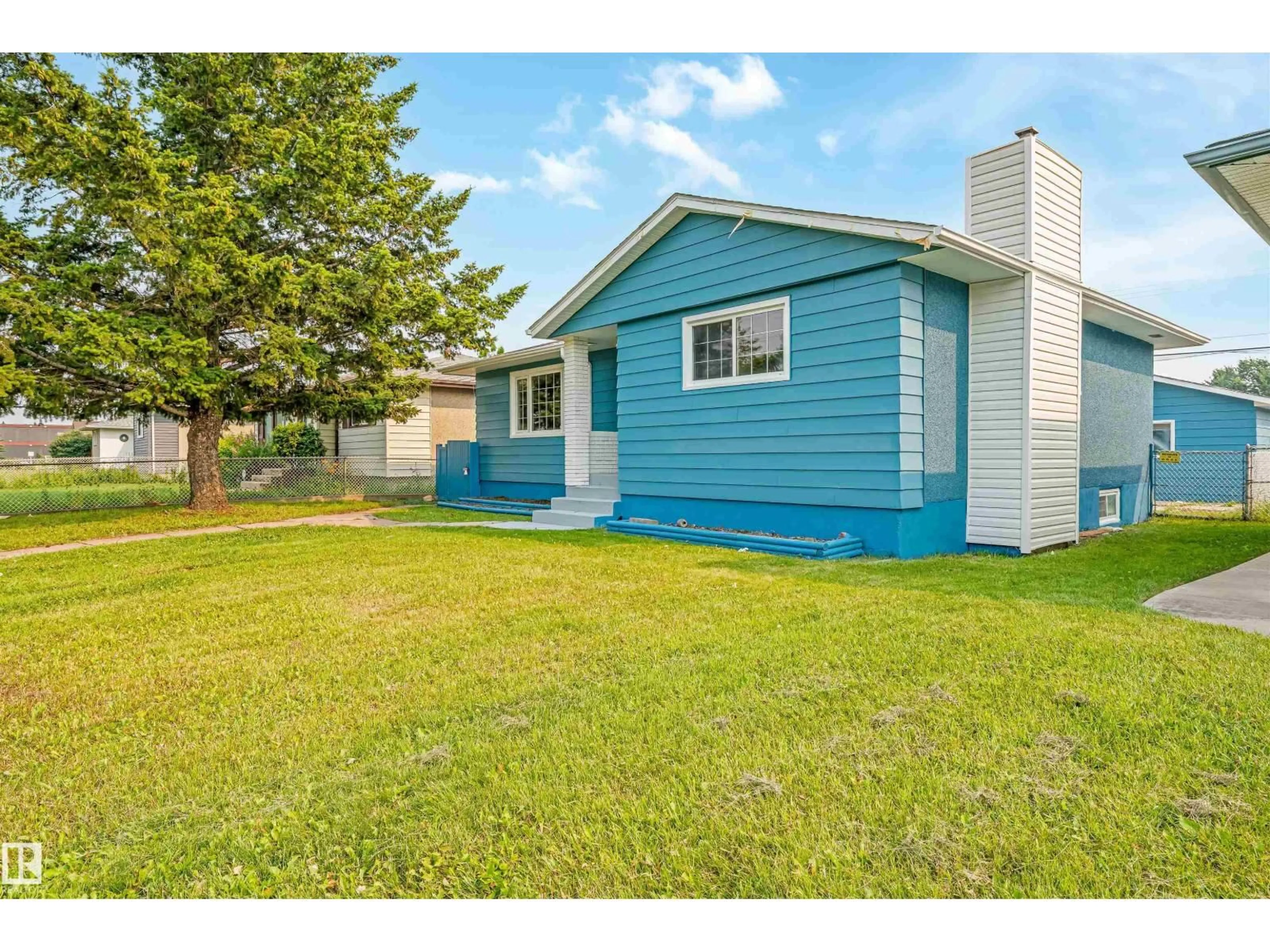 Home with vinyl exterior material, street for 12023 137 AV, Edmonton Alberta T5E1Z7