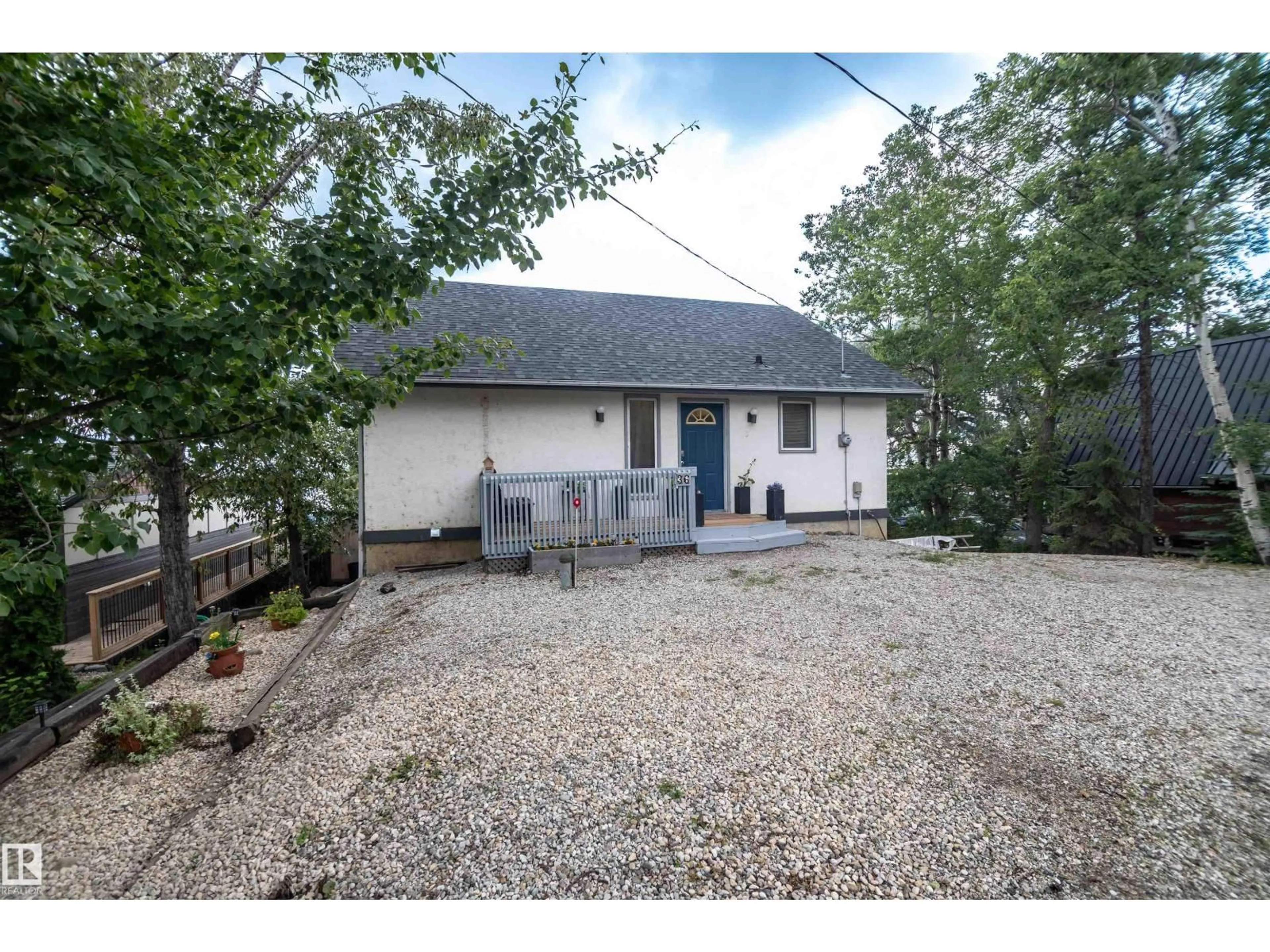 A pic from outside/outdoor area/front of a property/back of a property/a pic from drone, street for 55022 - 36 STE. ANNE TR, Rural Lac Ste. Anne County Alberta T0E1A0