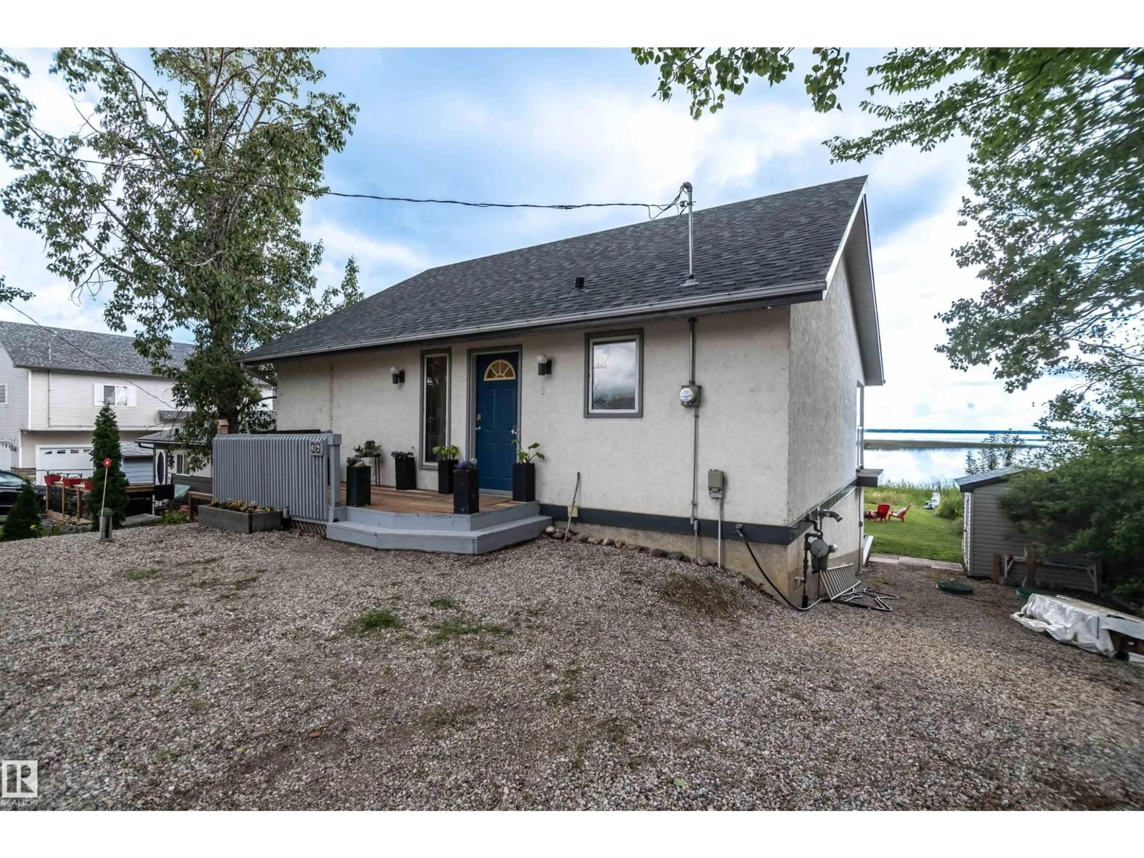 A pic from outside/outdoor area/front of a property/back of a property/a pic from drone, water/lake/river/ocean view for 55022 - 36 STE. ANNE TR, Rural Lac Ste. Anne County Alberta T0E1A0