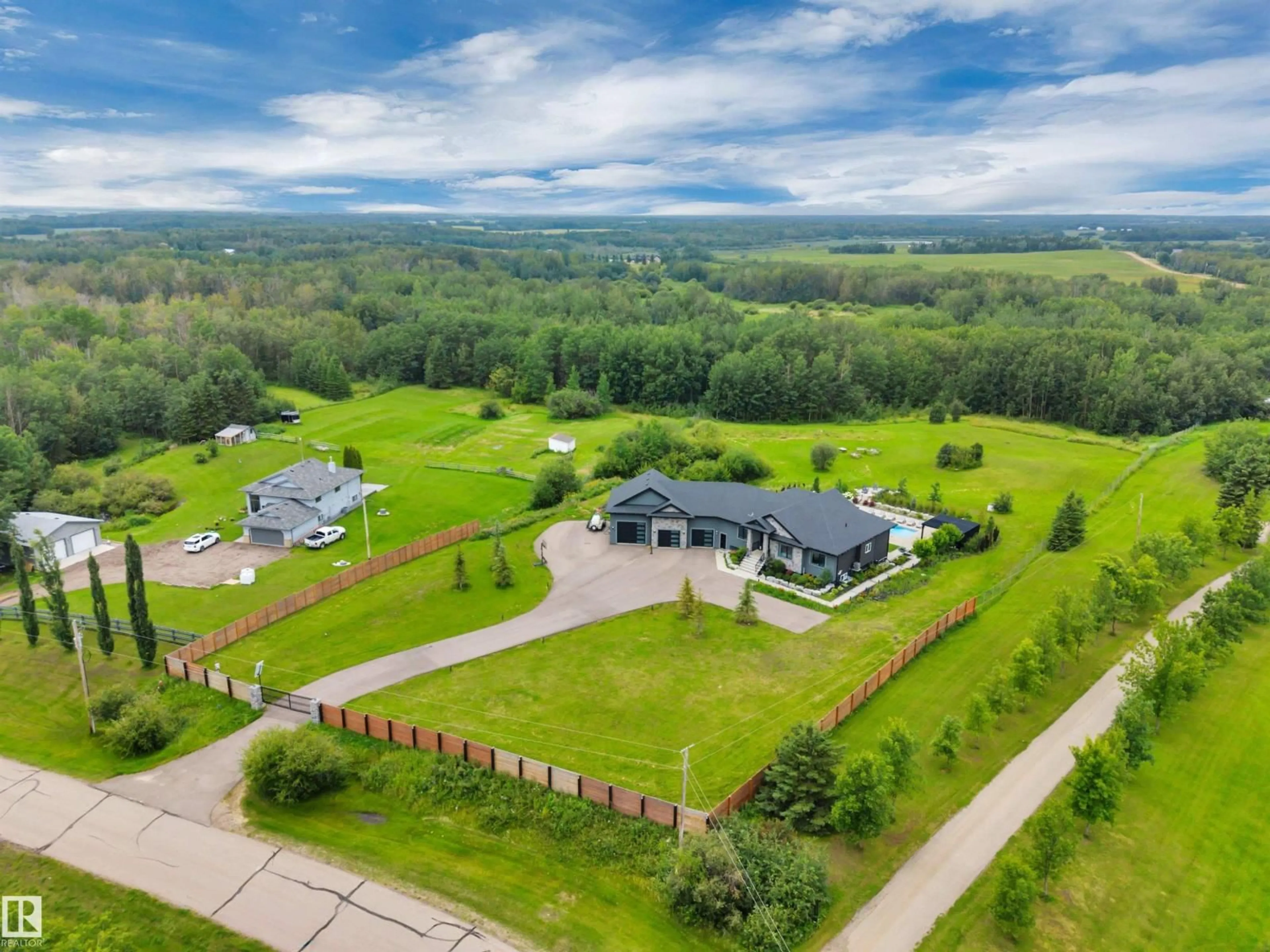 A pic from outside/outdoor area/front of a property/back of a property/a pic from drone, mountain view for 190 50450 RGE RD 222, Rural Leduc County Alberta T0B3M2