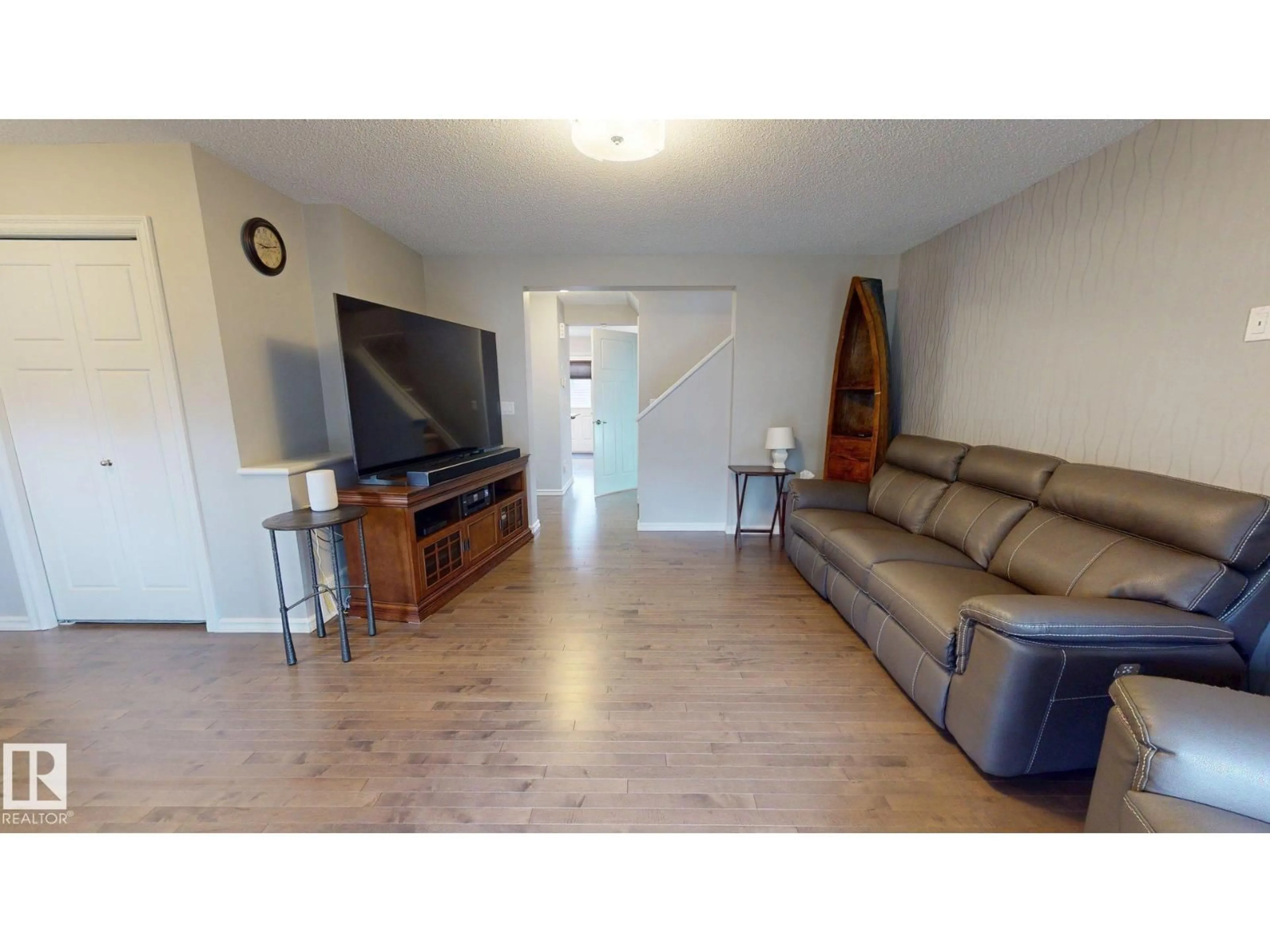 Living room with furniture, wood/laminate floor for 821 36A AV, Edmonton Alberta T6T0S5