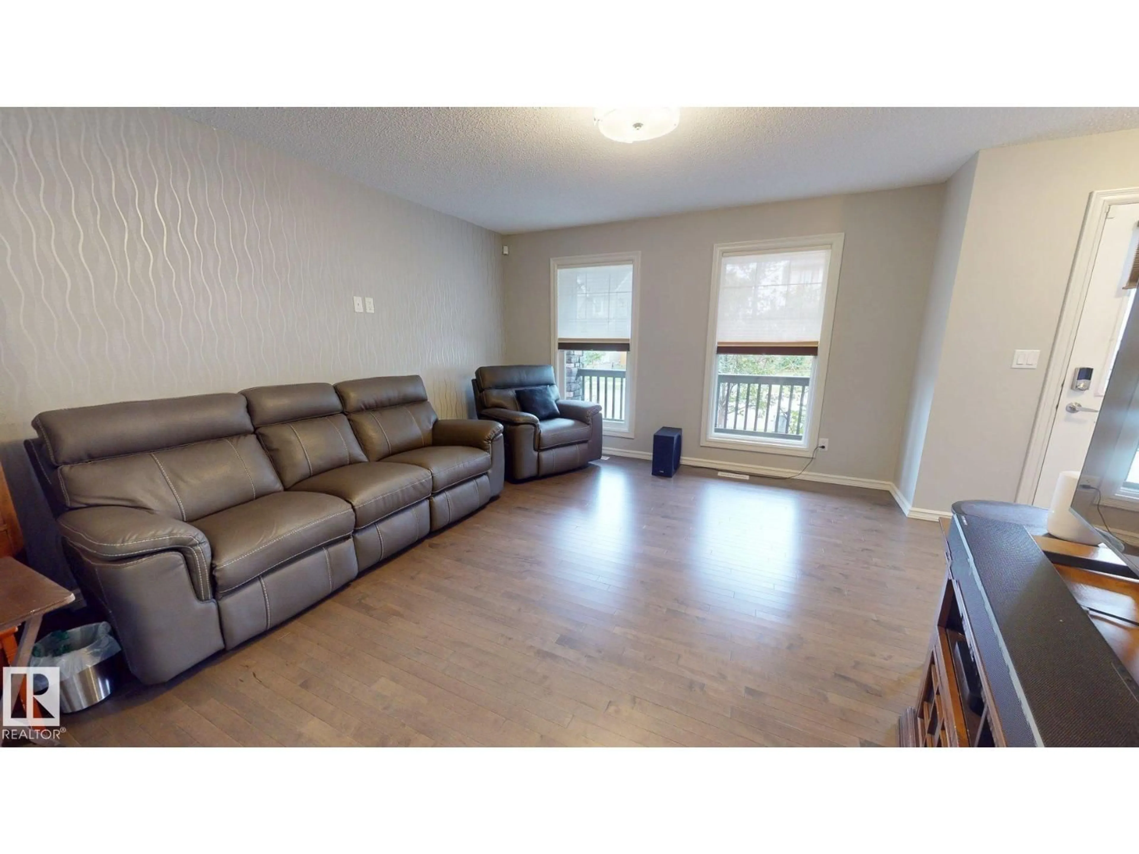 Living room with furniture, wood/laminate floor for 821 36A AV, Edmonton Alberta T6T0S5