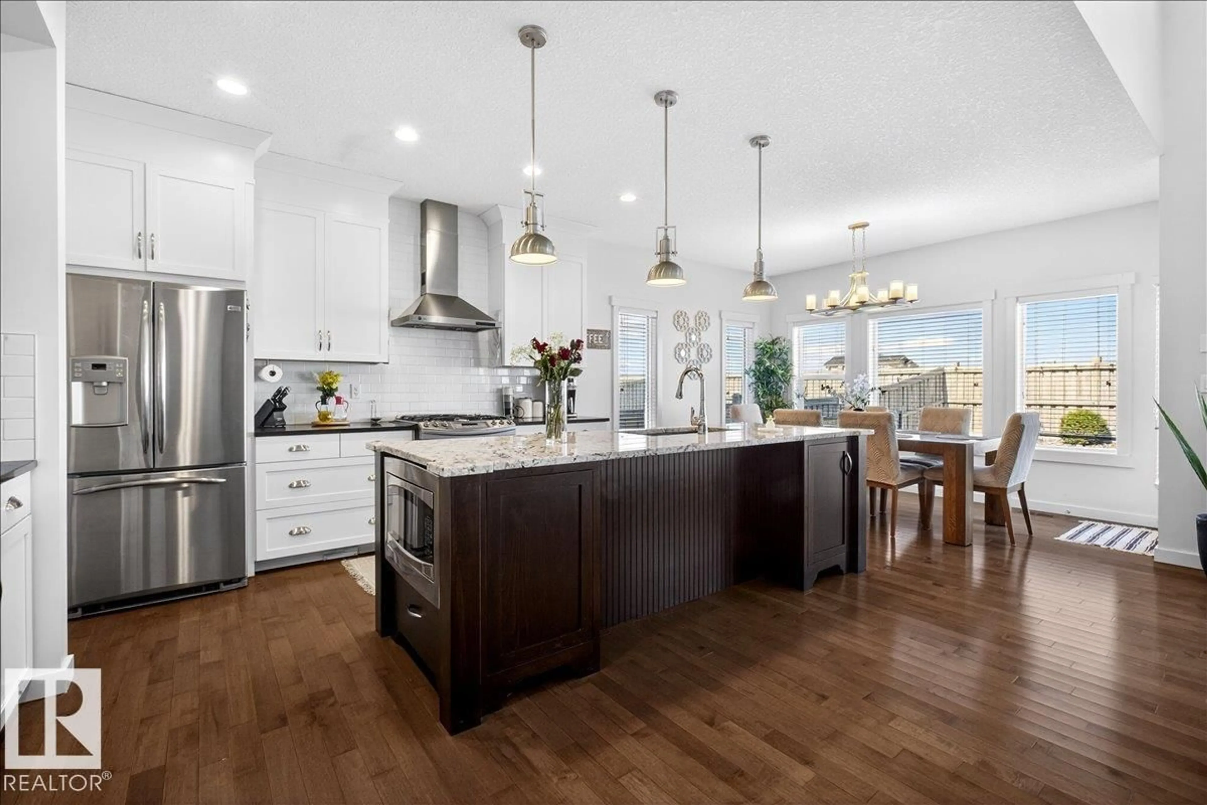Open concept kitchen, wood/laminate floor for 3936 CLAXTON LO, Edmonton Alberta T6W1Y6