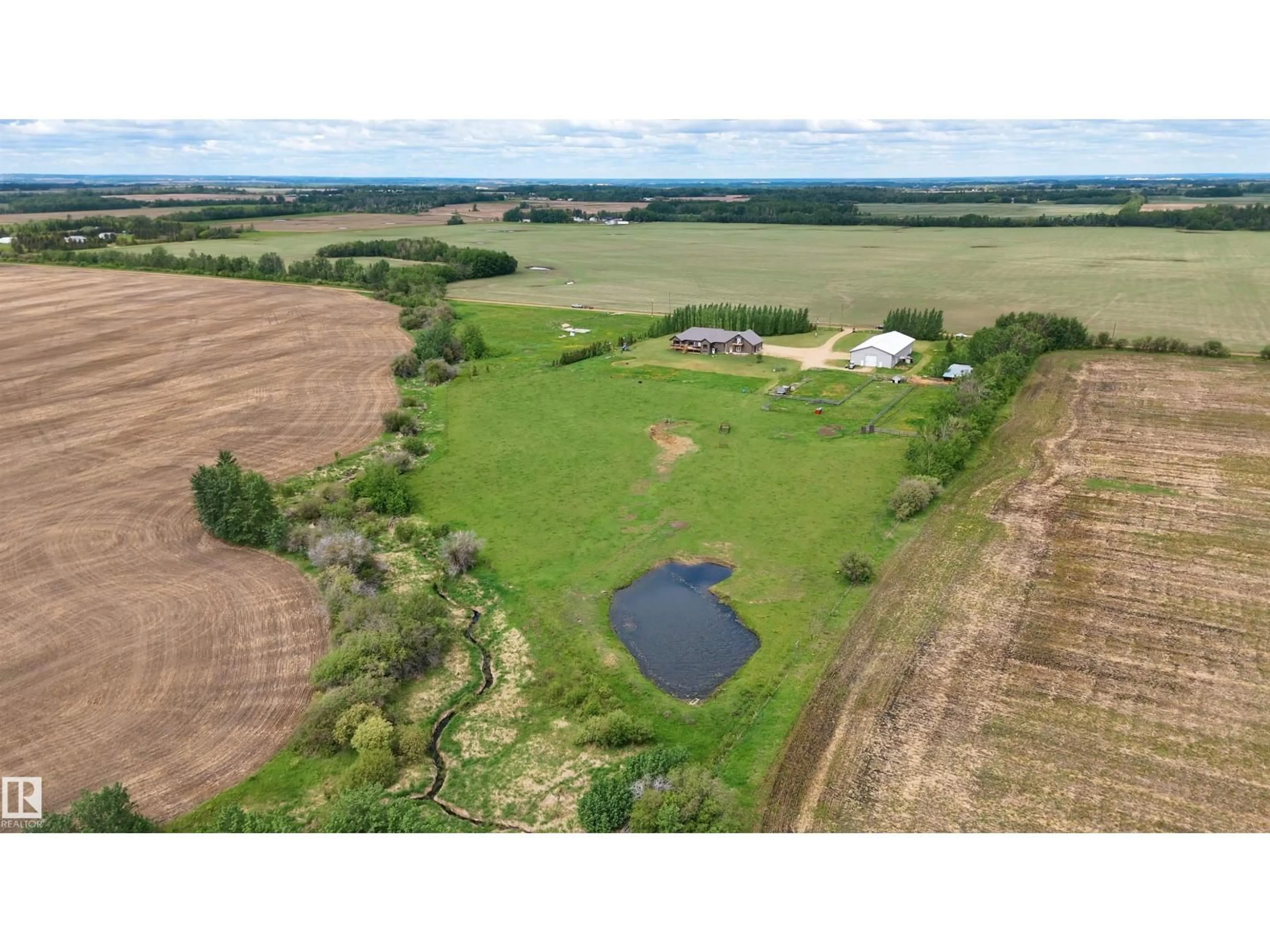 A pic from outside/outdoor area/front of a property/back of a property/a pic from drone, water/lake/river/ocean view for 26517 TWP ROAD 584, Rural Westlock County Alberta T0G1W0