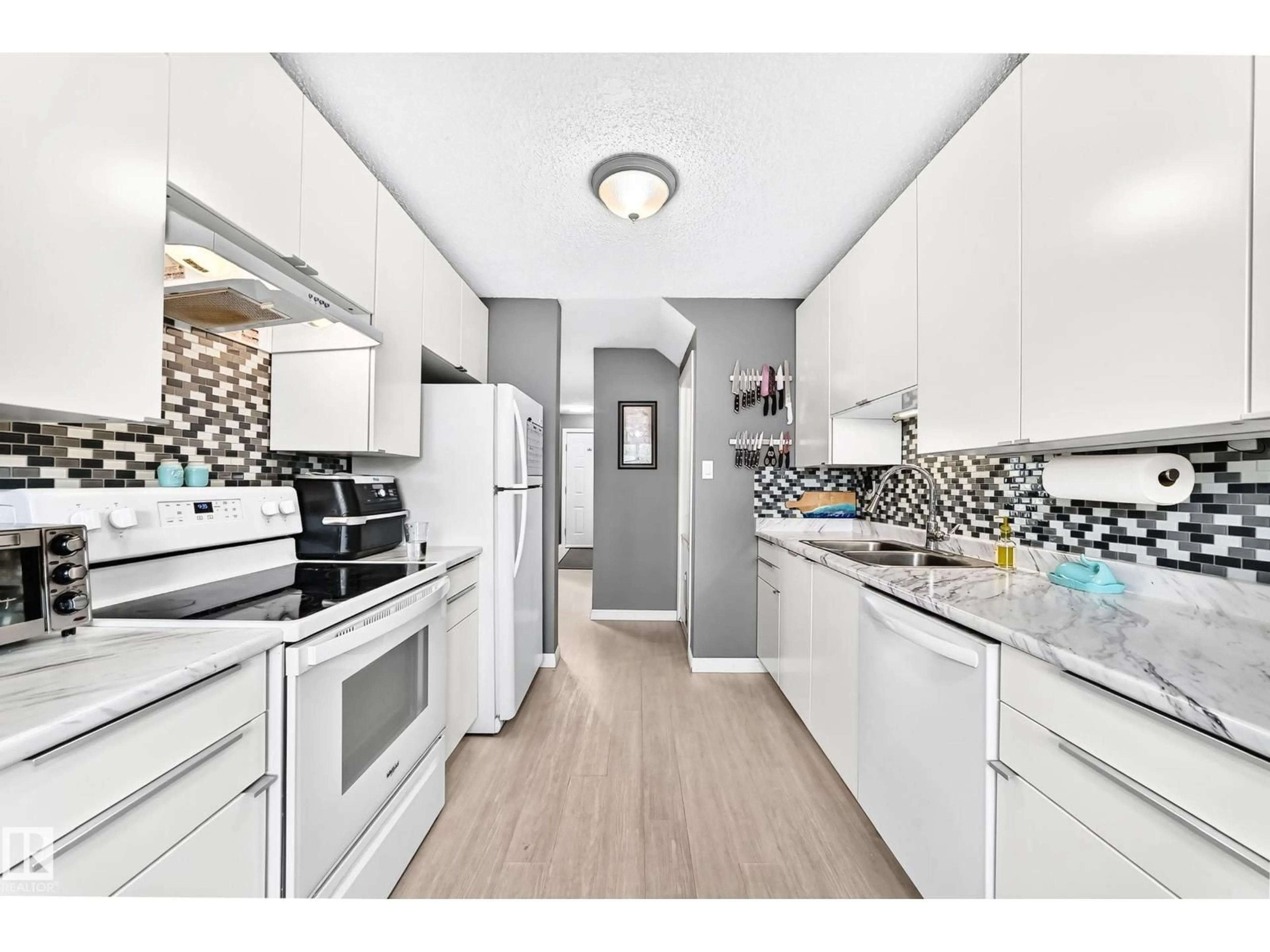 Open concept kitchen, unknown for #30 - 1651 46 ST, Edmonton Alberta T6L5H2