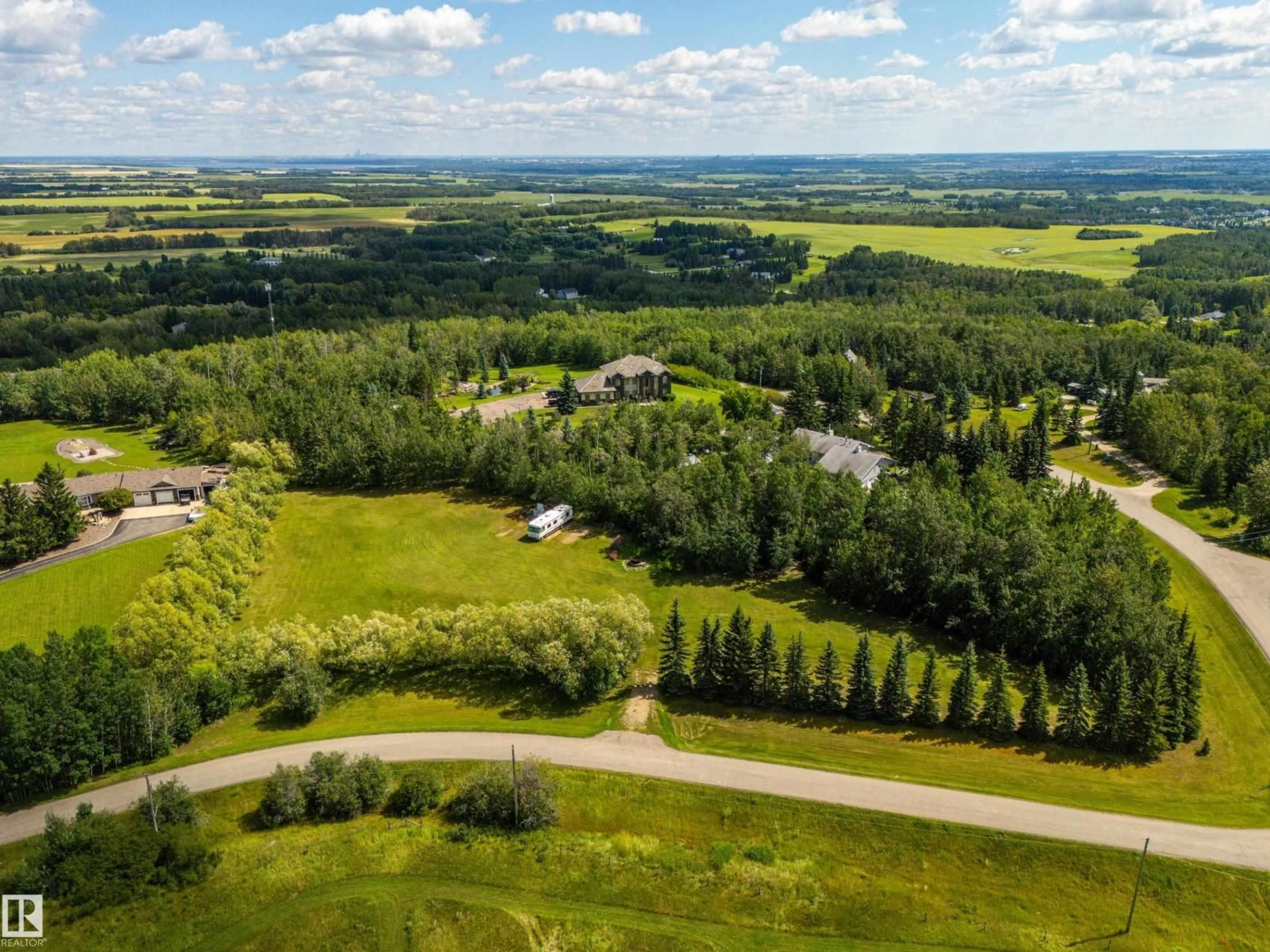 A pic from outside/outdoor area/front of a property/back of a property/a pic from drone, forest/trees view for 53504 - 65 RGE ROAD 274 RGE ROAD, Rural Parkland County Alberta T7X3T1