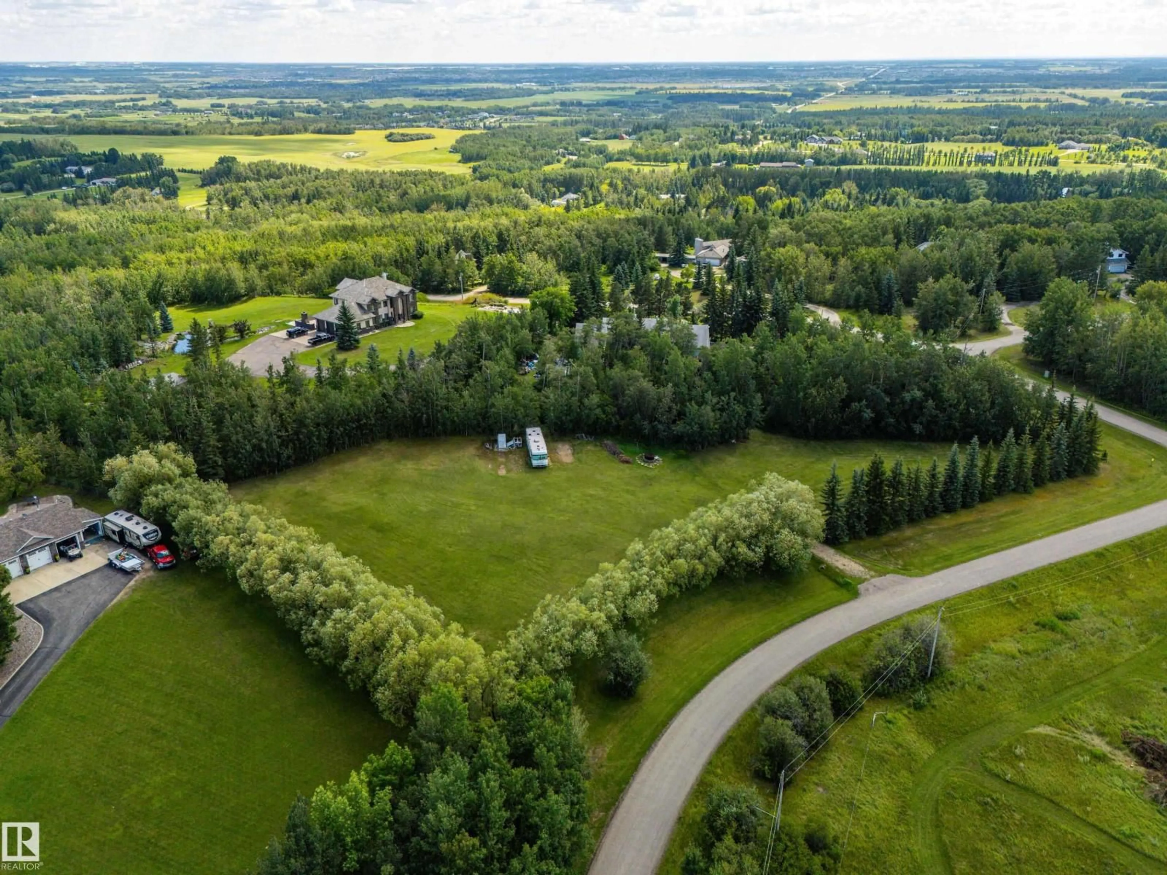 A pic from outside/outdoor area/front of a property/back of a property/a pic from drone, forest/trees view for 53504 - 65 RGE ROAD 274 RGE ROAD, Rural Parkland County Alberta T7X3T1