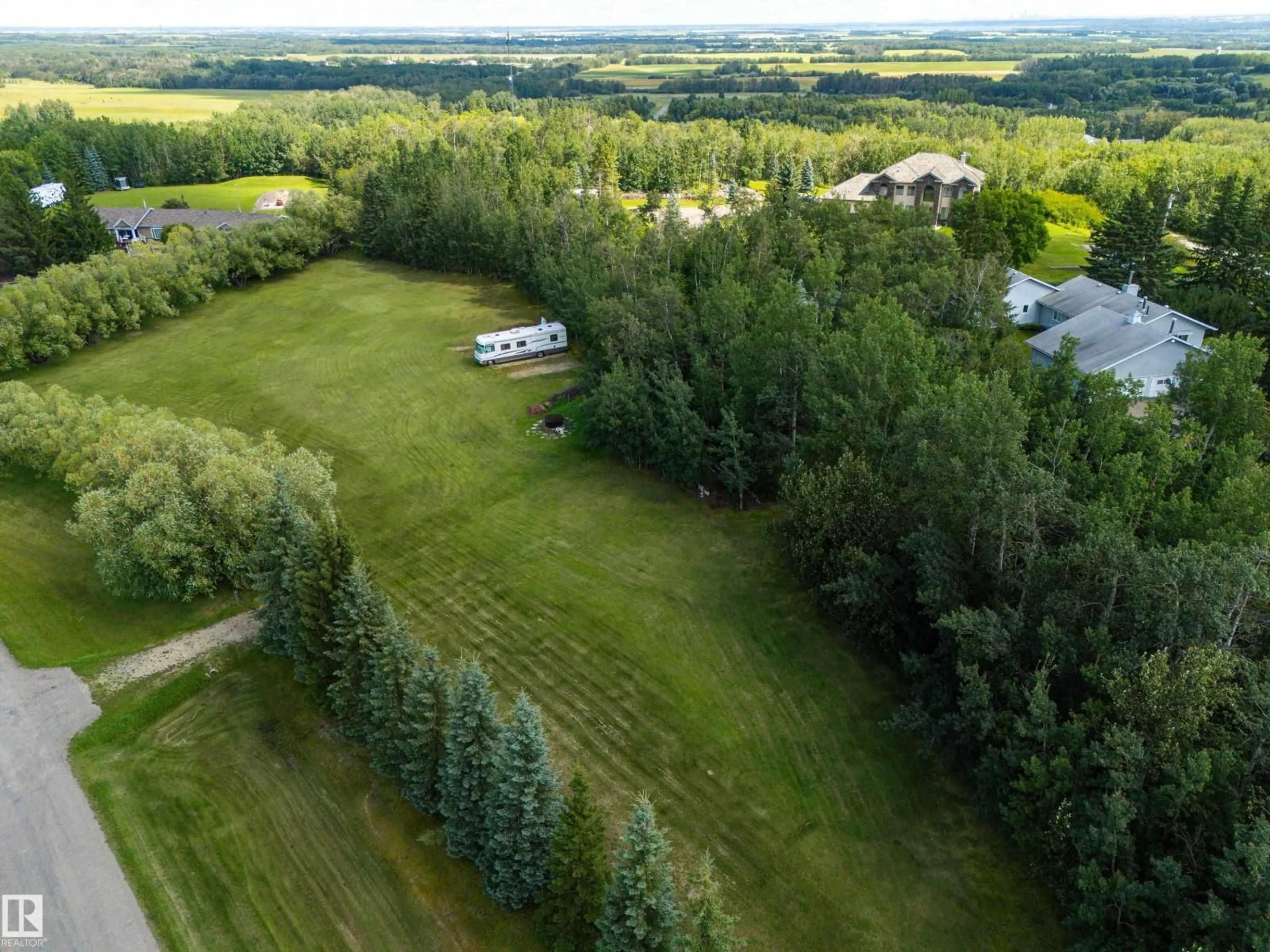 A pic from outside/outdoor area/front of a property/back of a property/a pic from drone, forest/trees view for 53504 - 65 RGE ROAD 274 RGE ROAD, Rural Parkland County Alberta T7X3T1