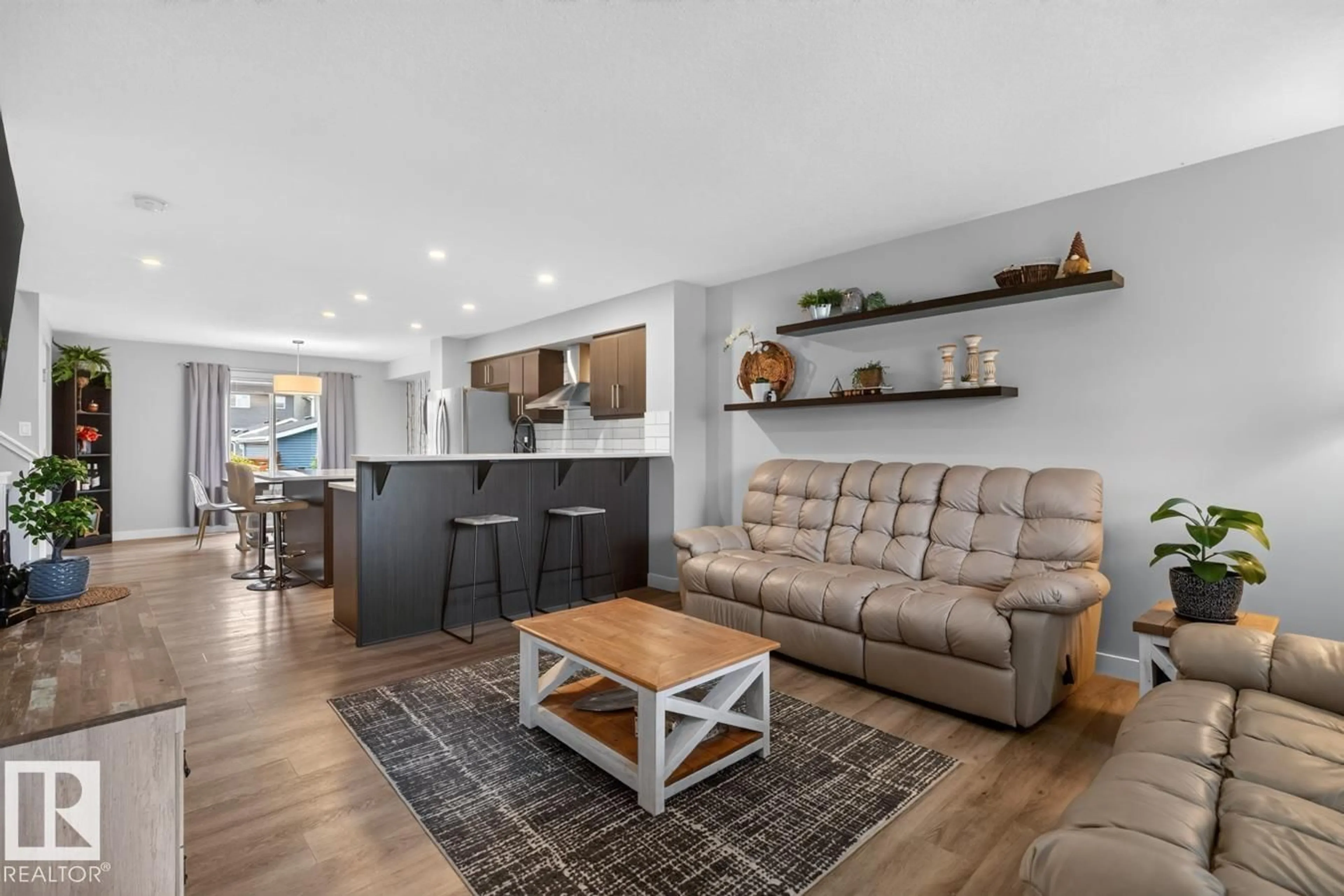 Open concept kitchen, wood/laminate floor for 384 STOUT LN, Leduc Alberta T9E1K4