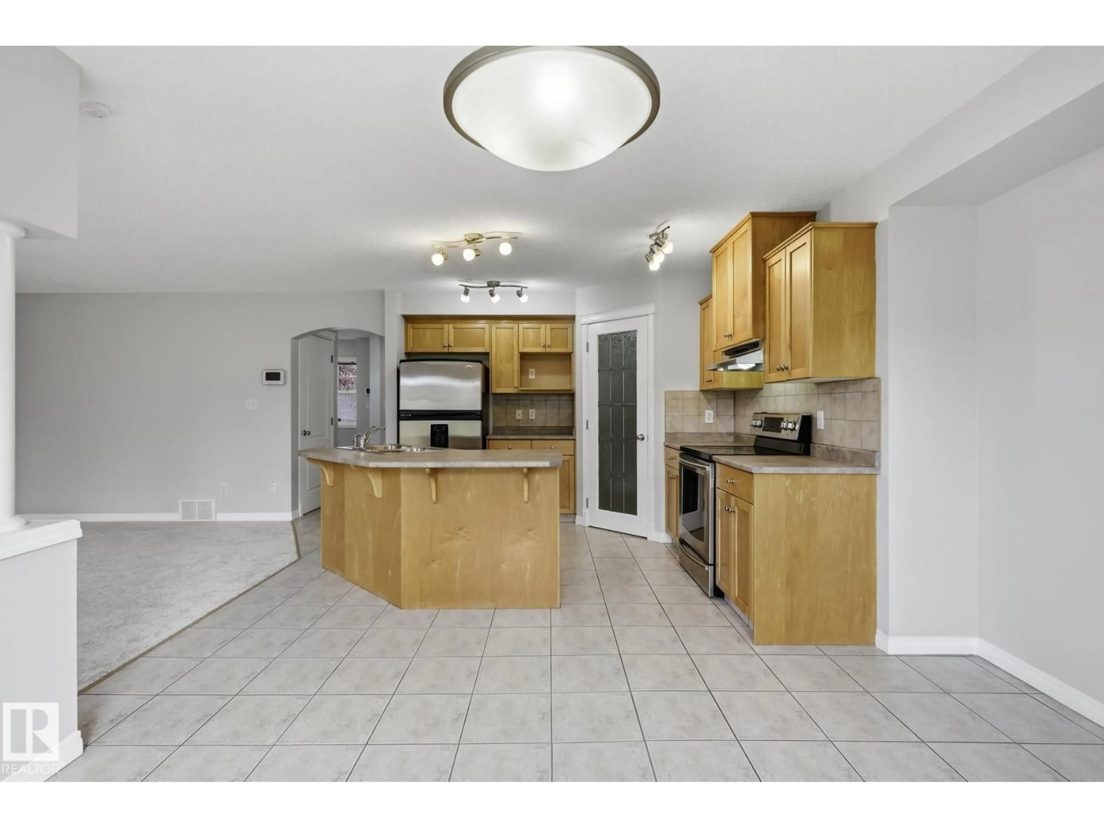 Open concept kitchen, ceramic/tile floor for SW - 10719 8 AV, Edmonton Alberta T6W1G4