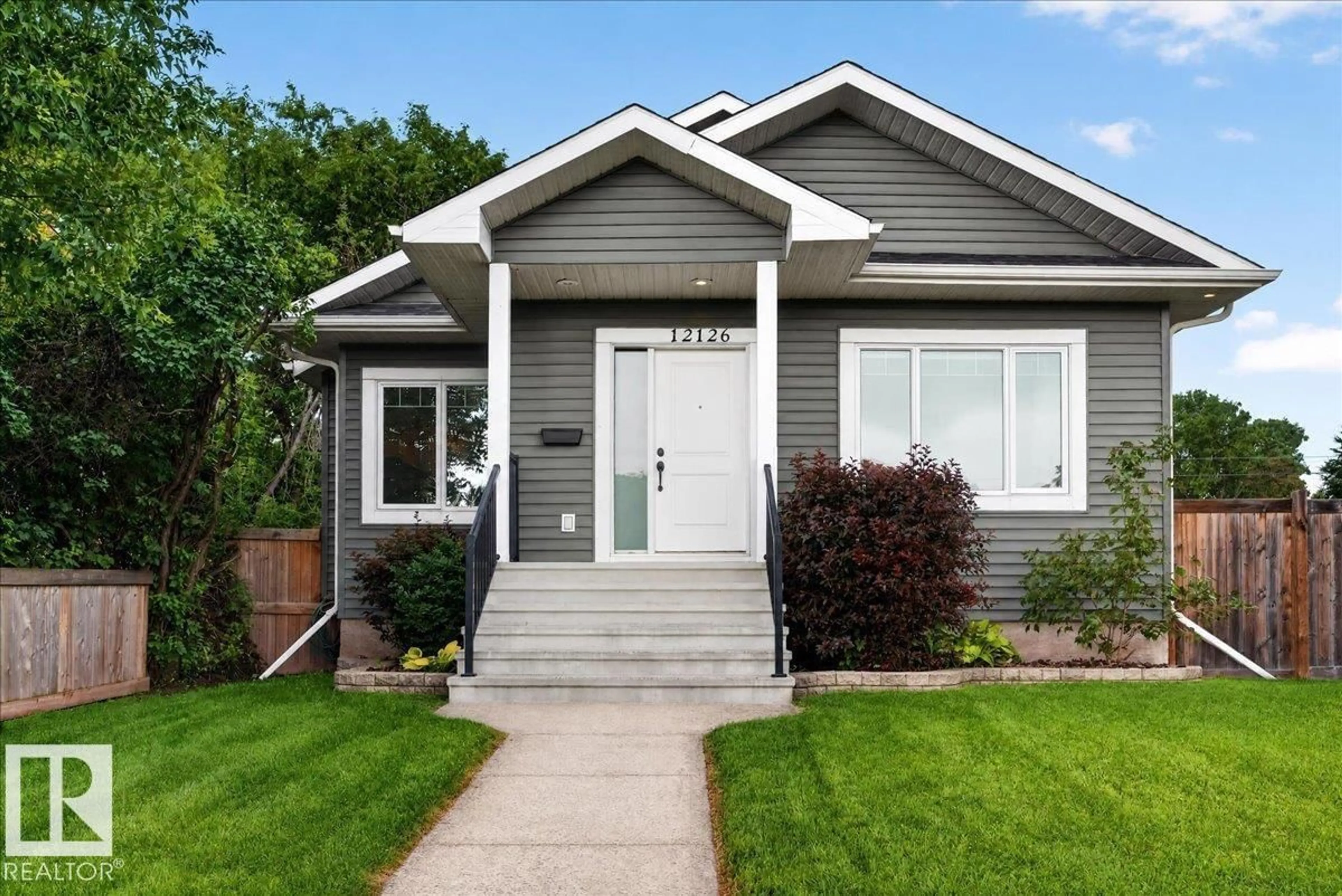 Home with vinyl exterior material, street for 12126 47 ST, Edmonton Alberta T5W2X5