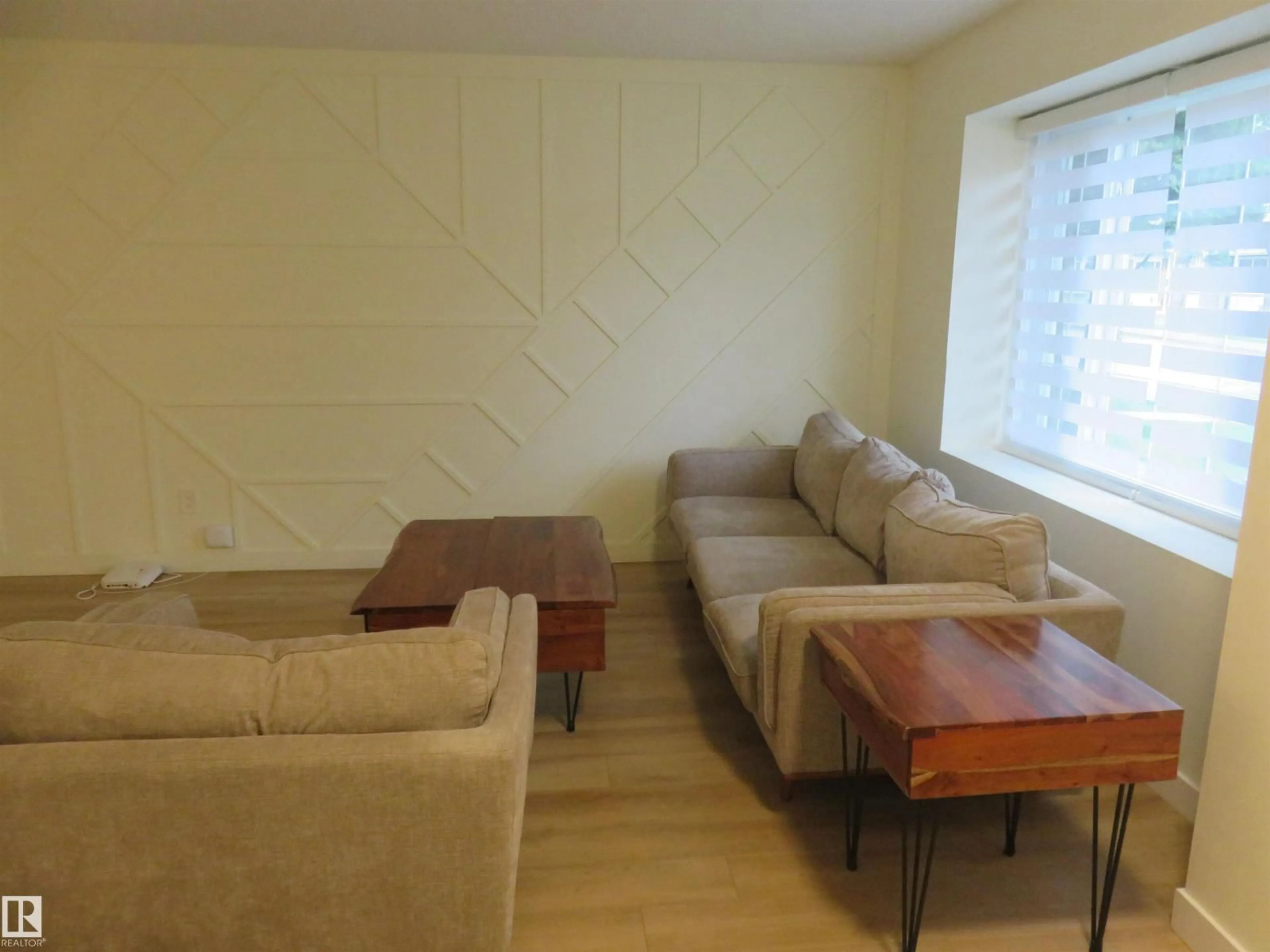 Living room with furniture, wood/laminate floor for NW - 8065 178 ST, Edmonton Alberta T5T1L3