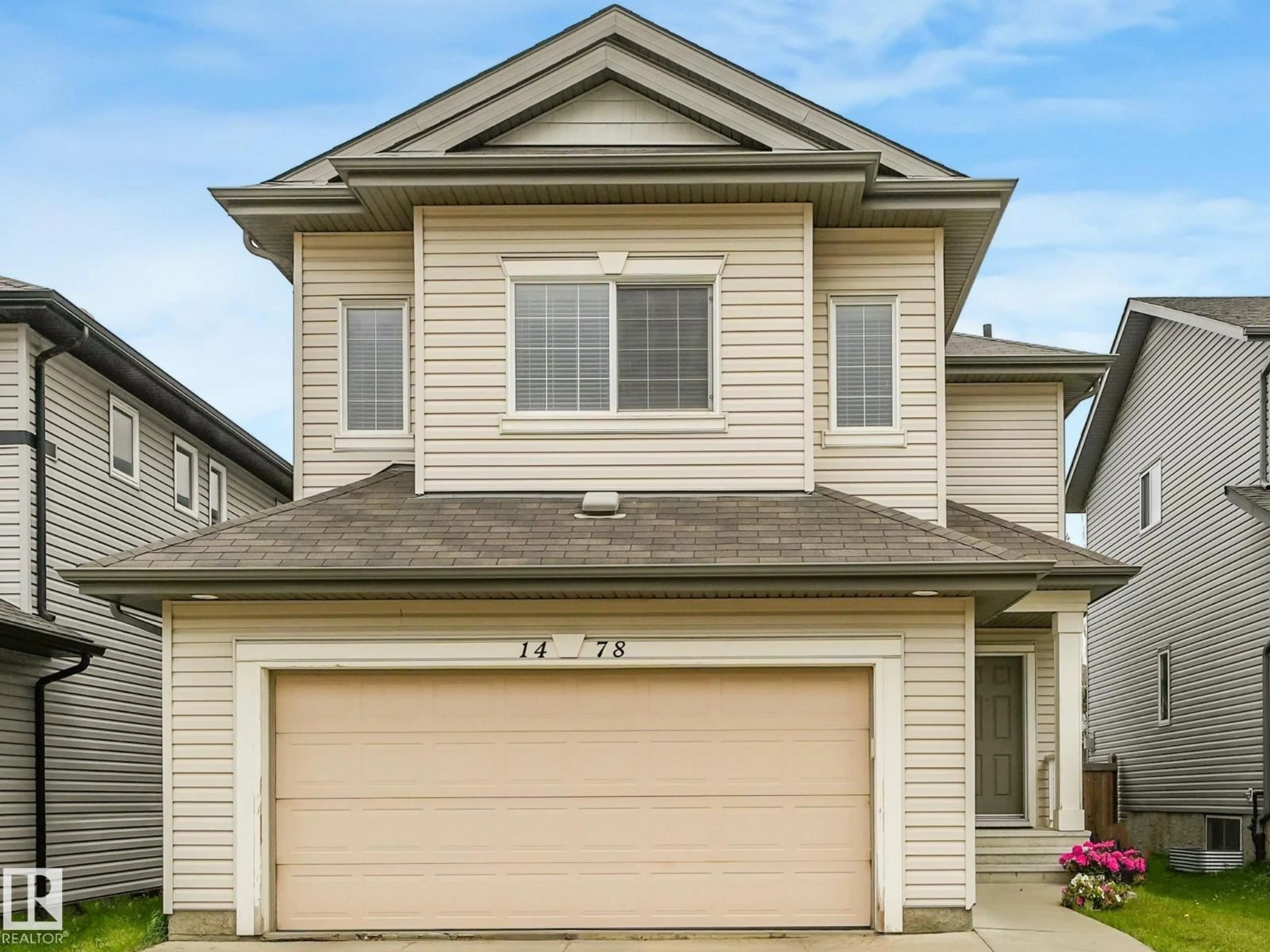 Home with vinyl exterior material, street for 1478 37B AV, Edmonton Alberta T6T0J1