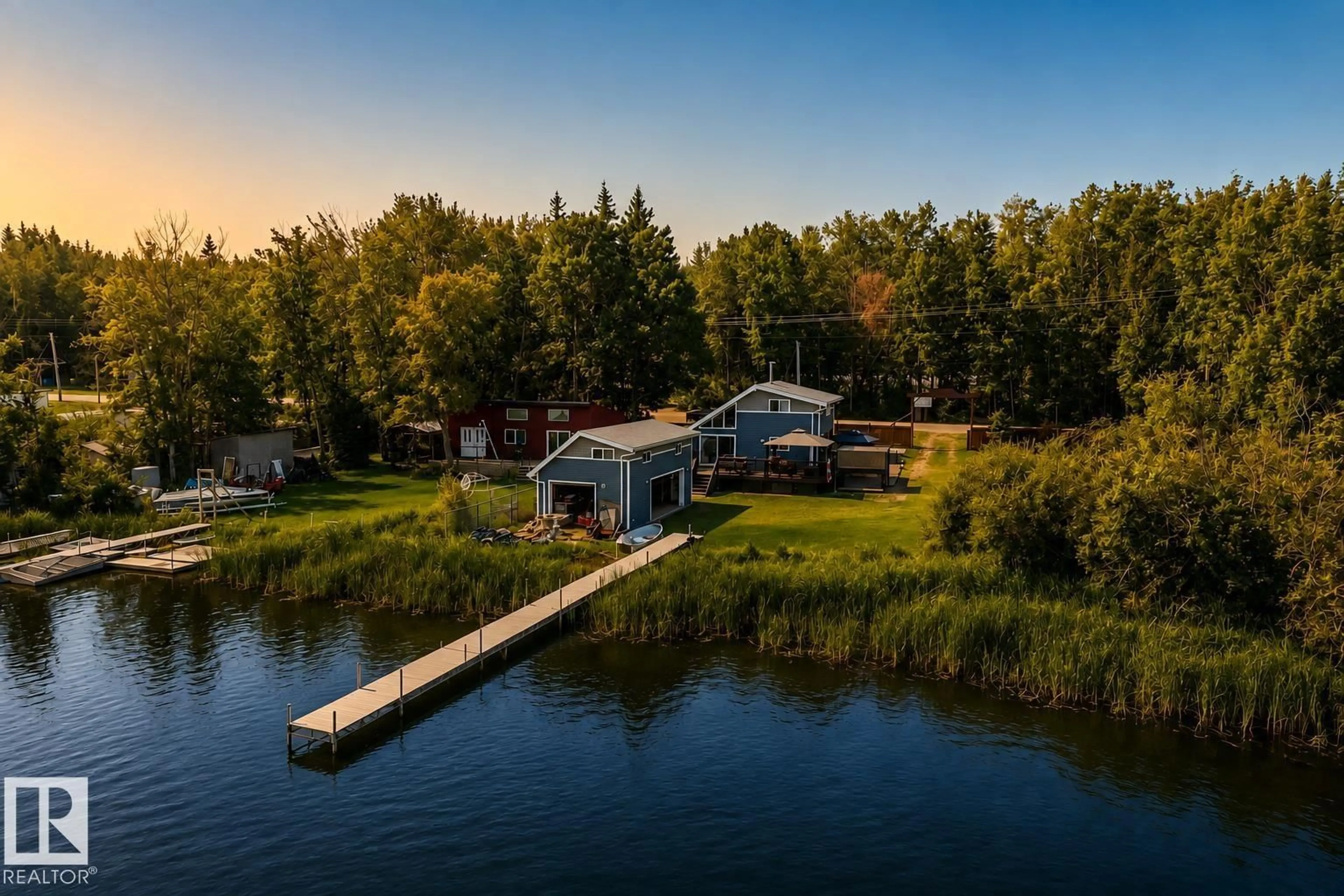 A pic from outside/outdoor area/front of a property/back of a property/a pic from drone, water/lake/river/ocean view for 264 BEACH AV, Rural Barrhead County Alberta T0E1V0