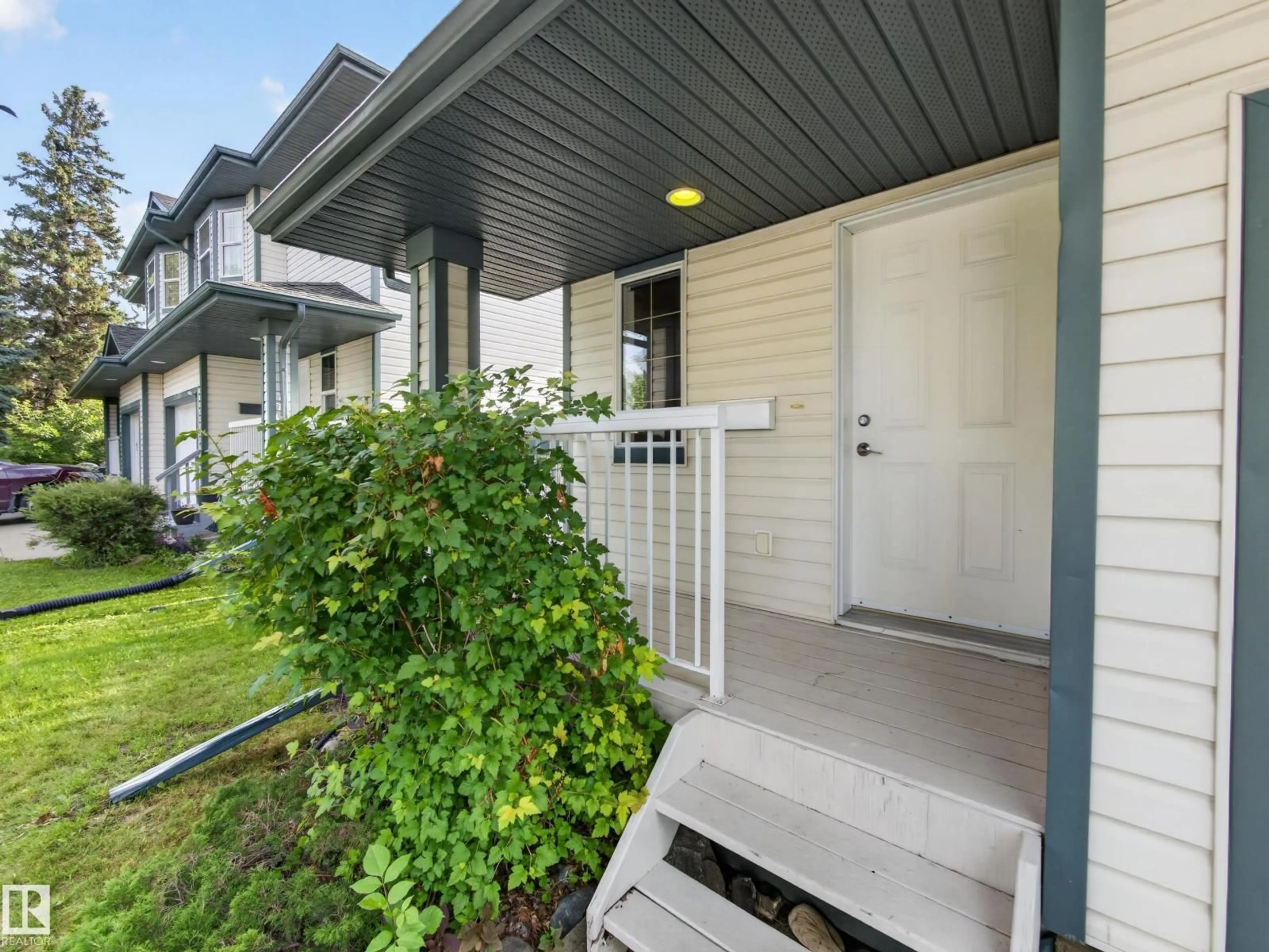 Home with vinyl exterior material, street for NW - 13003 101 ST, Edmonton Alberta T5E4G1