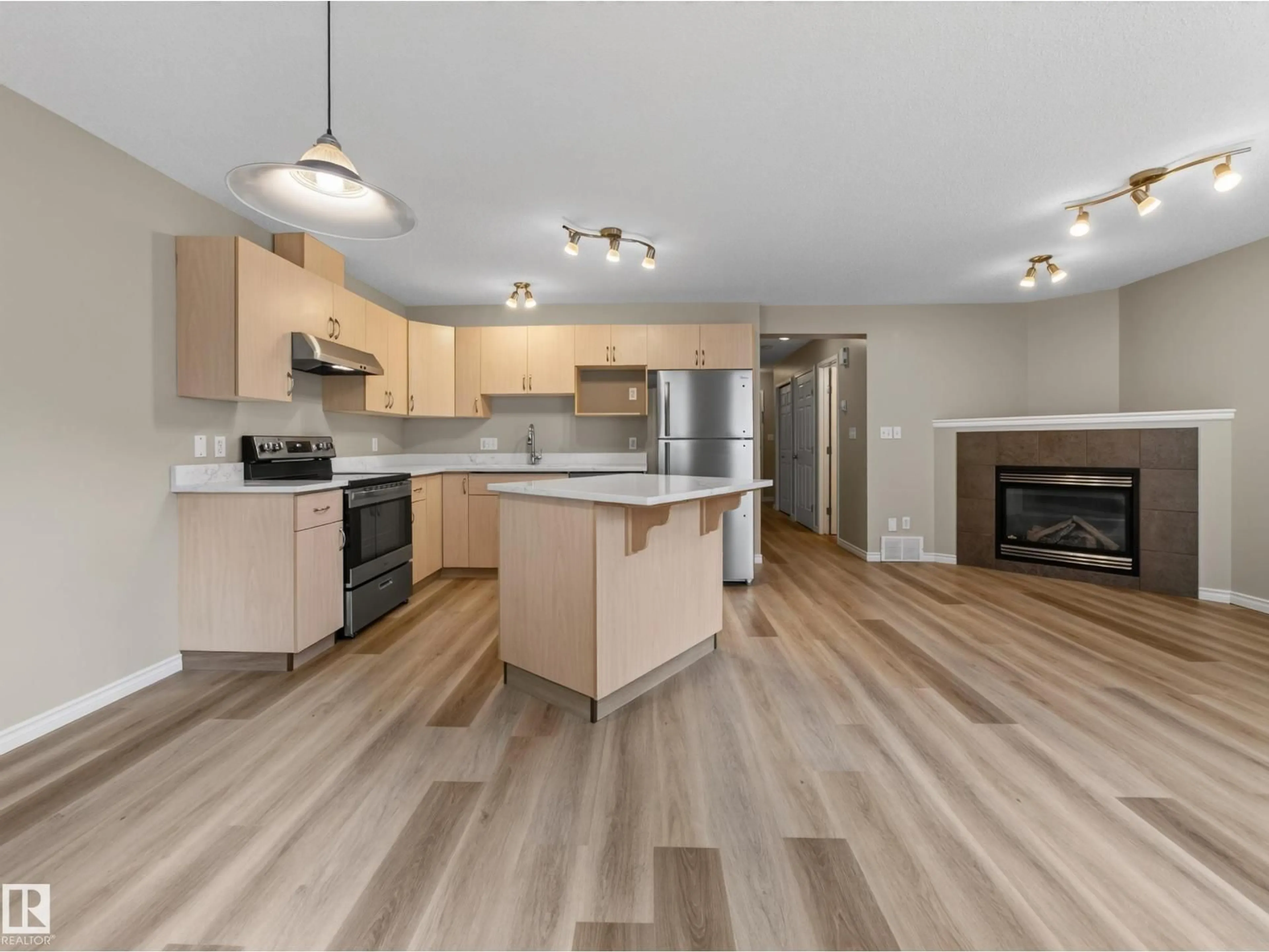 Open concept kitchen, wood/laminate floor for NW - 13003 101 ST, Edmonton Alberta T5E4G1