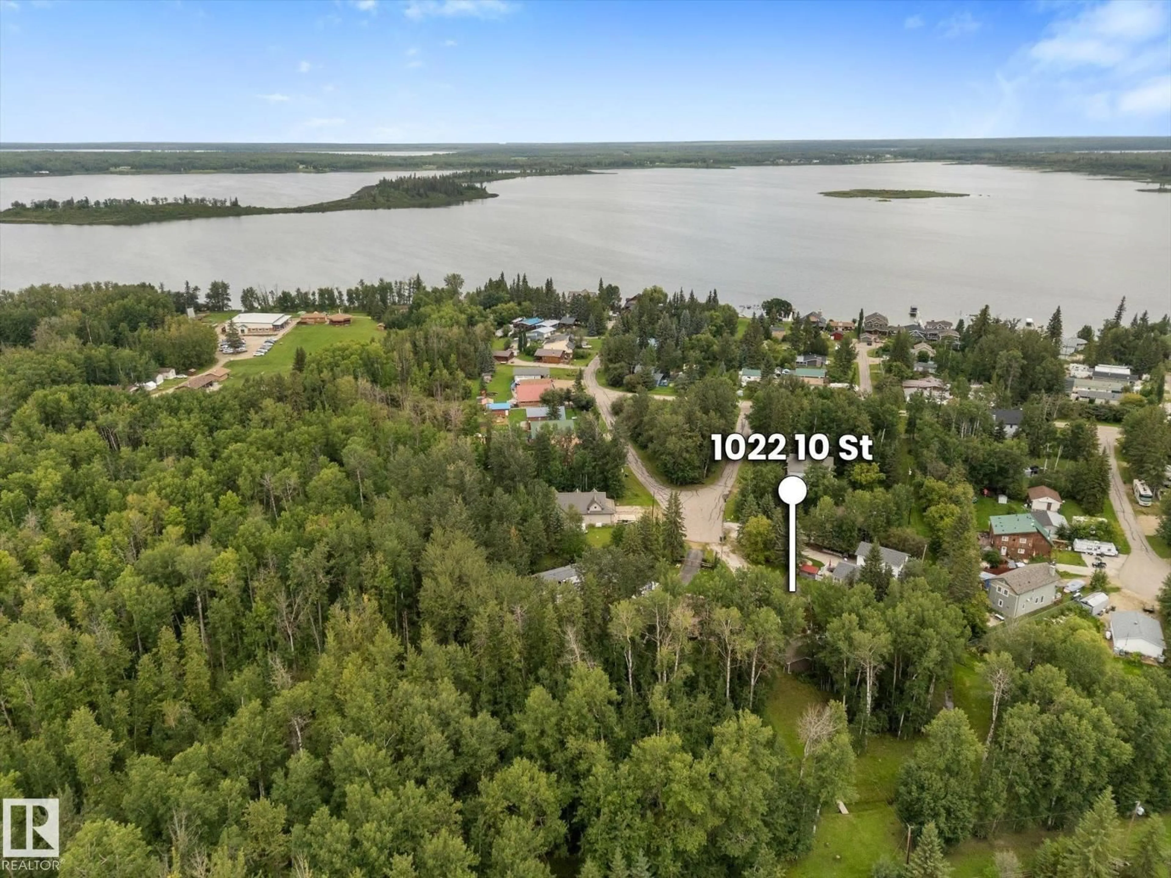 A pic from outside/outdoor area/front of a property/back of a property/a pic from drone, water/lake/river/ocean view for 1022 10 ST, Rural Lac Ste. Anne County Alberta T0E0A0
