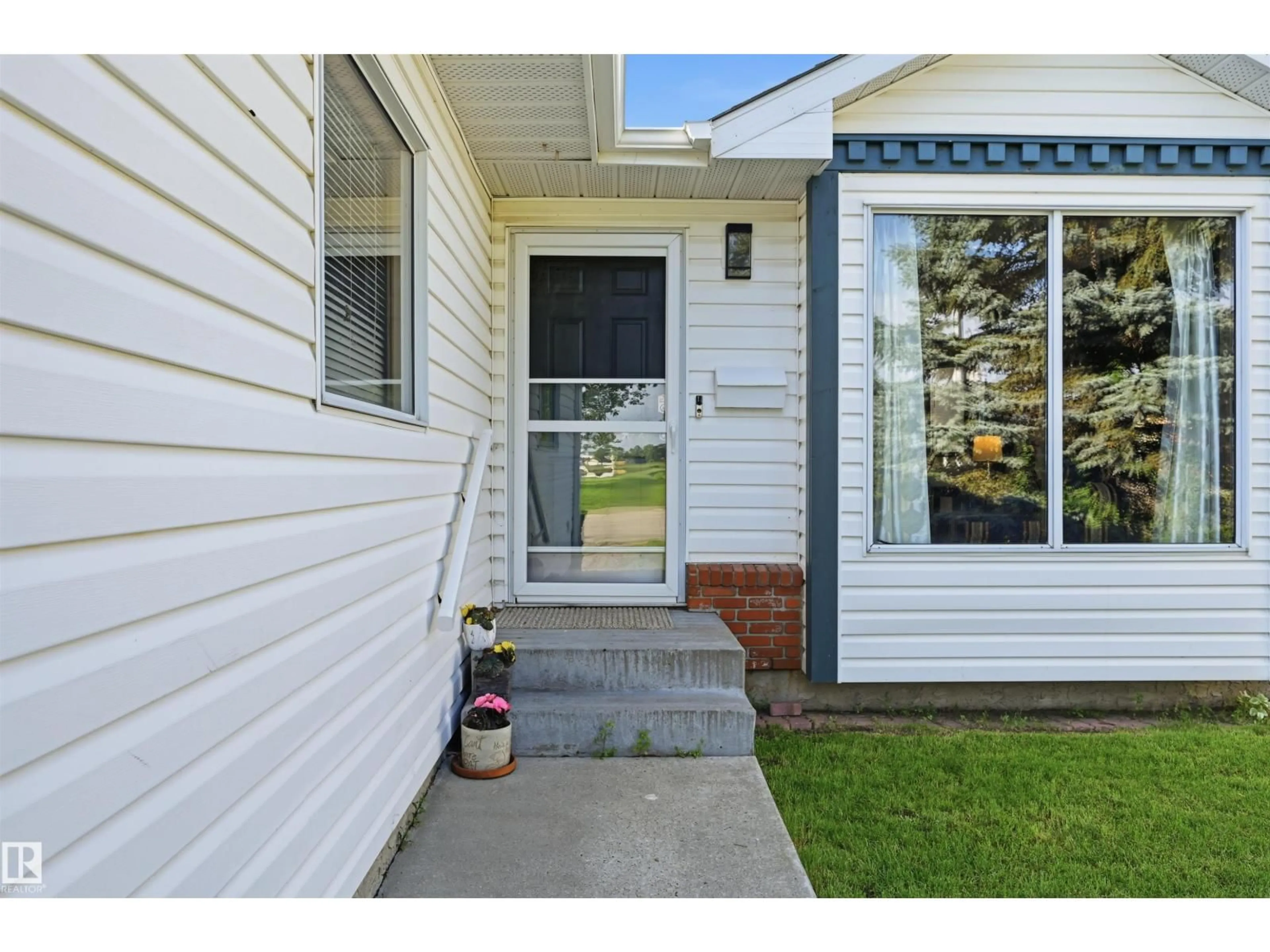 Home with vinyl exterior material, street for 18639 72 AV, Edmonton Alberta T5T5T5