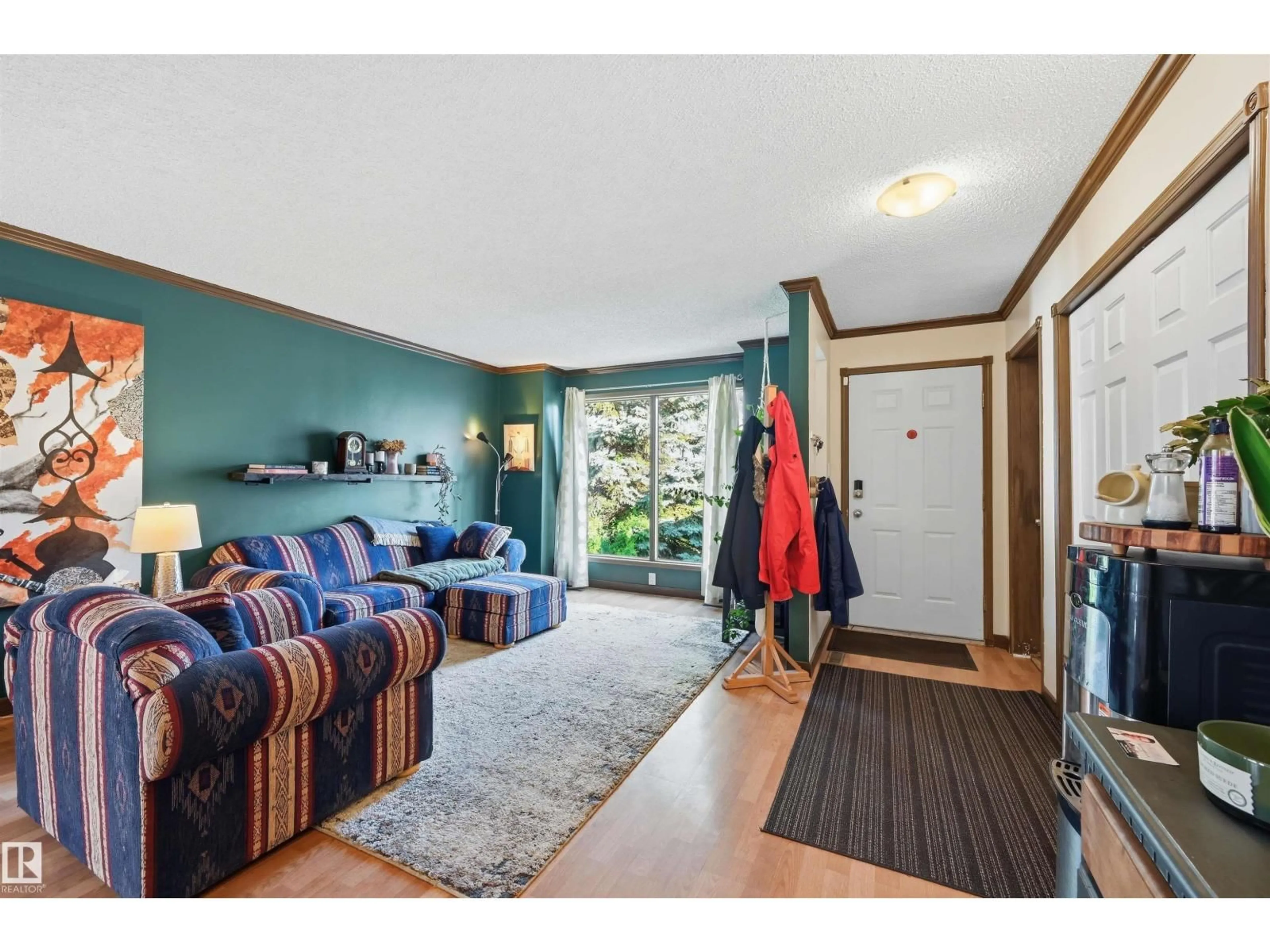 Living room with furniture, wood/laminate floor for 18639 72 AV, Edmonton Alberta T5T5T5