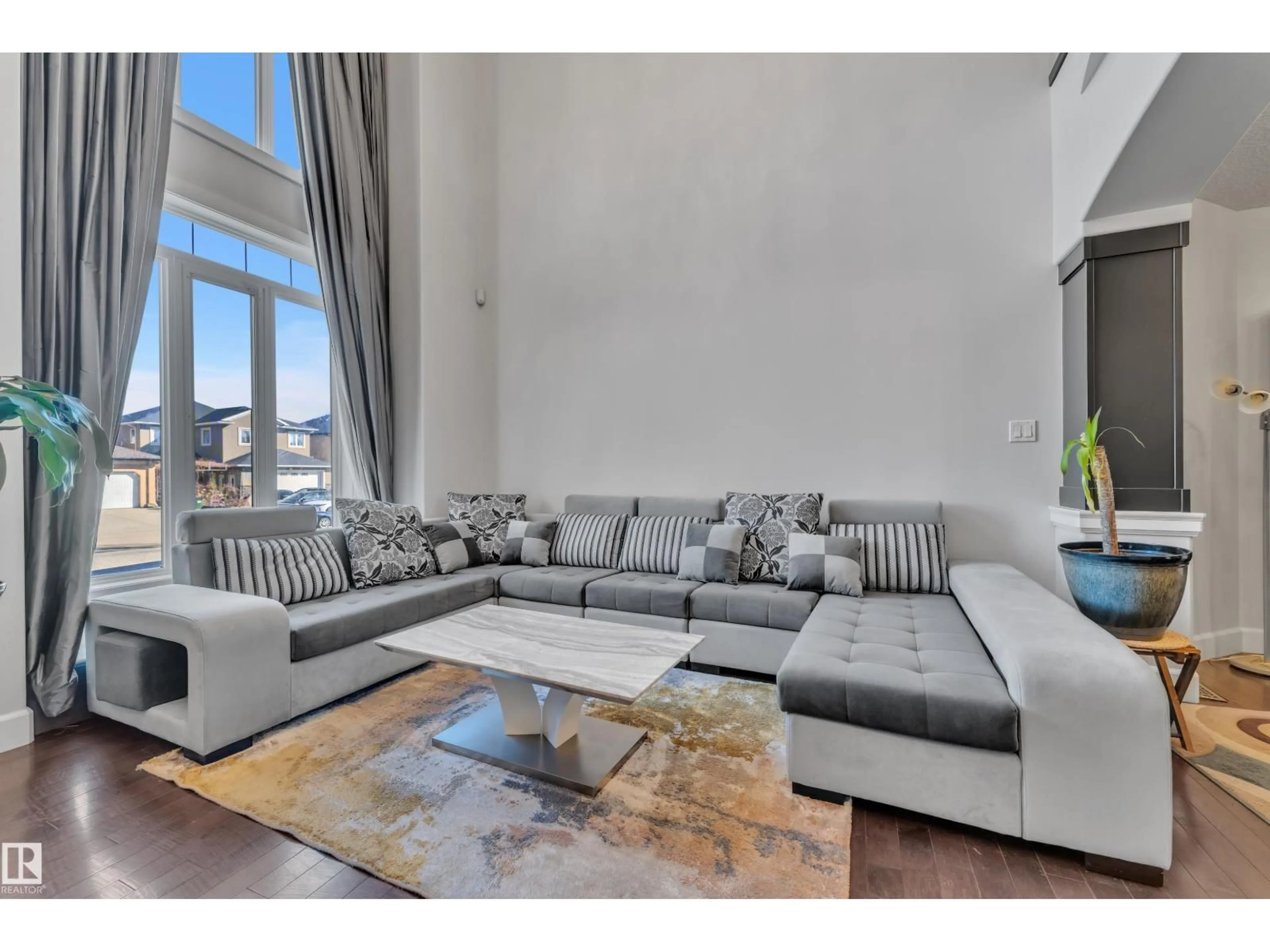 Living room with furniture, unknown for 10915 175 AV, Edmonton Alberta T5X0B7