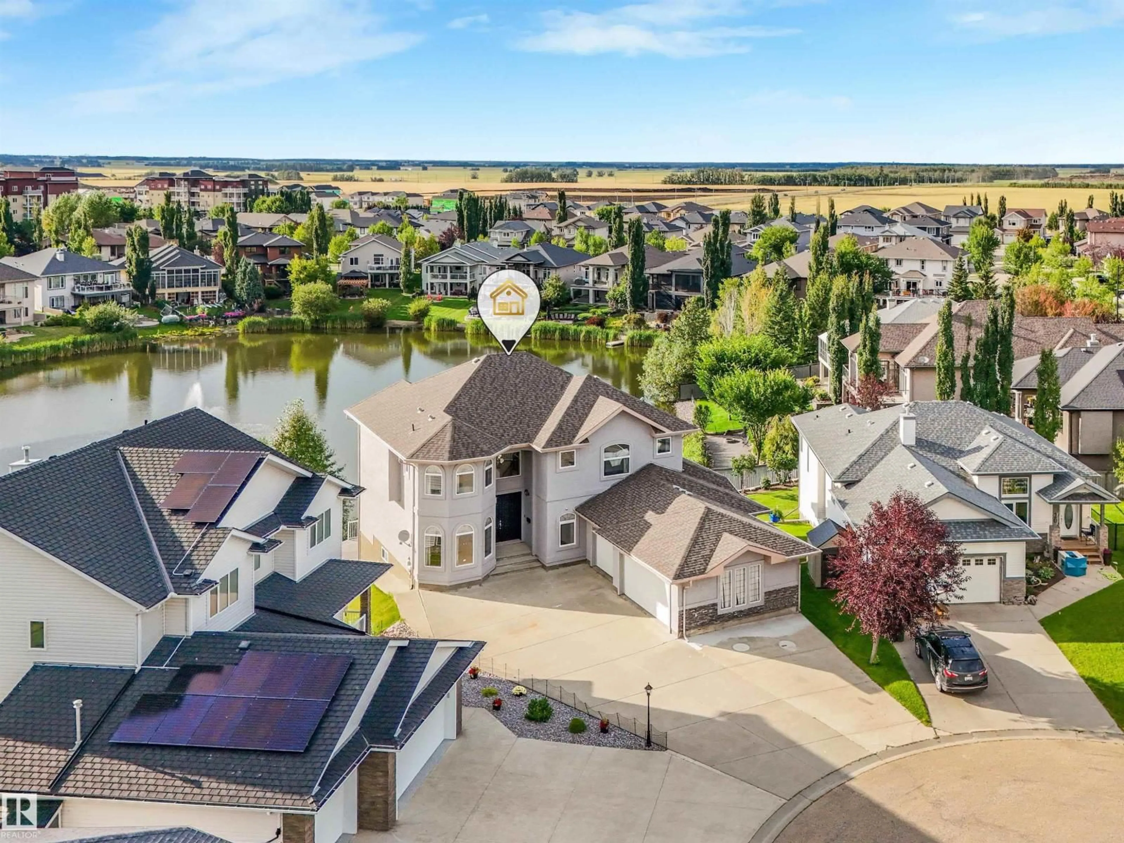 A pic from outside/outdoor area/front of a property/back of a property/a pic from drone, water/lake/river/ocean view for 22 SHORES DR, Leduc Alberta T9E8N8